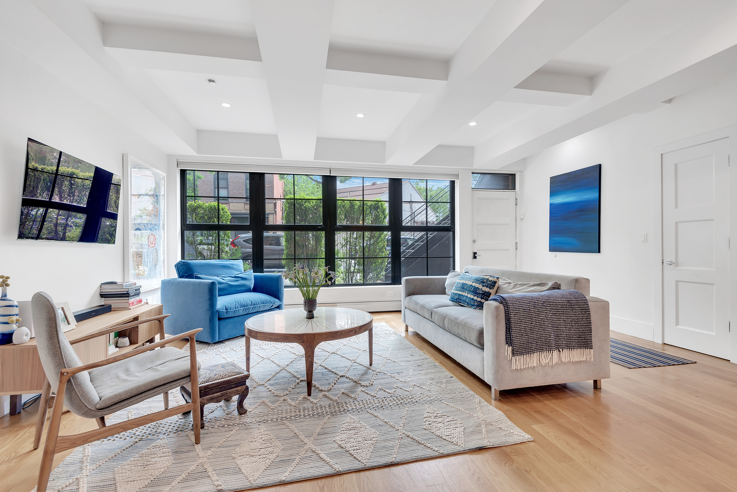 49 Summit Street, Unit 1C Brooklyn, NY 11231 - Photo 3 of 10 a living room with furniture and a flat screen tv
