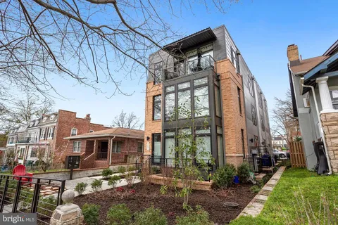 a front view of a building with garden