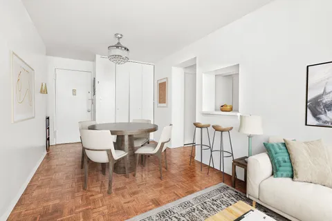 a living room with furniture and a table