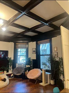 a living room with a couch and a window