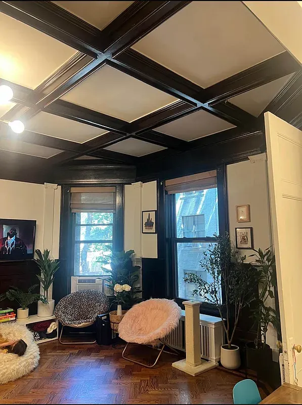 a living room with a couch and a window