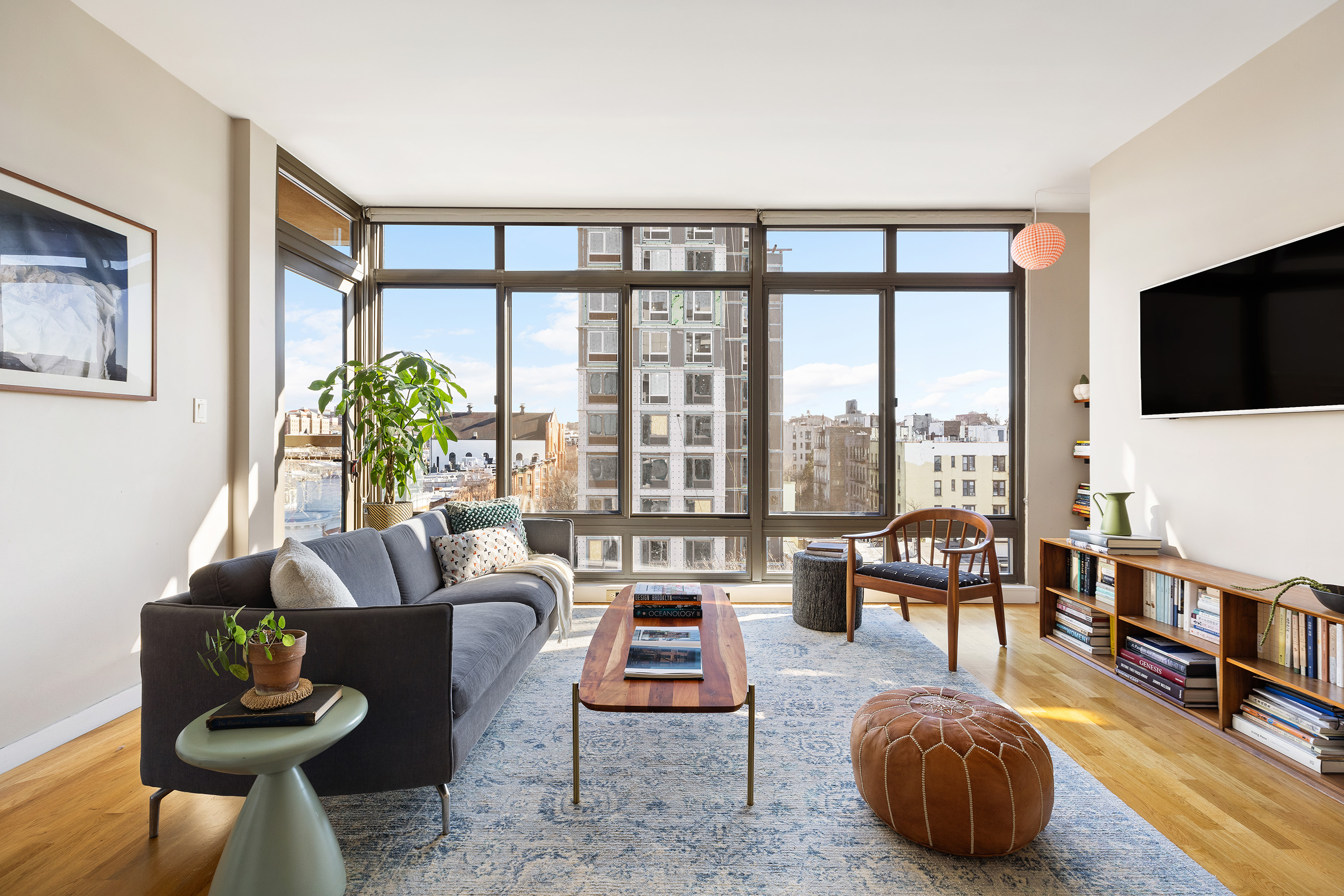 500 4th Avenue, Unit 7C Brooklyn, NY 11215 - Photo 1 of 12 a living room with furniture and a flat screen tv