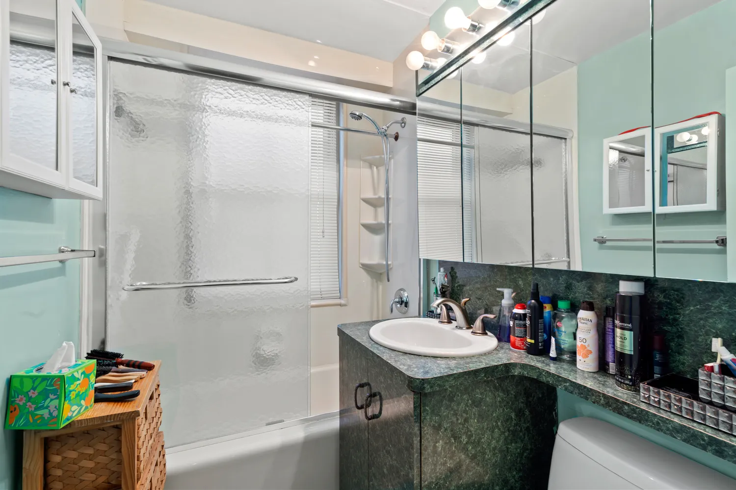 a bathroom with a sink and a shower