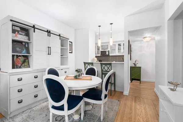 a dining room with furniture and window