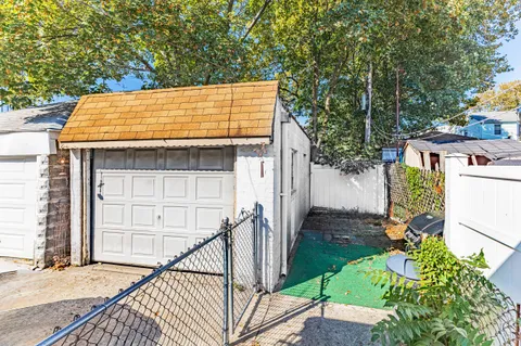 a backyard of a house with outdoor seating