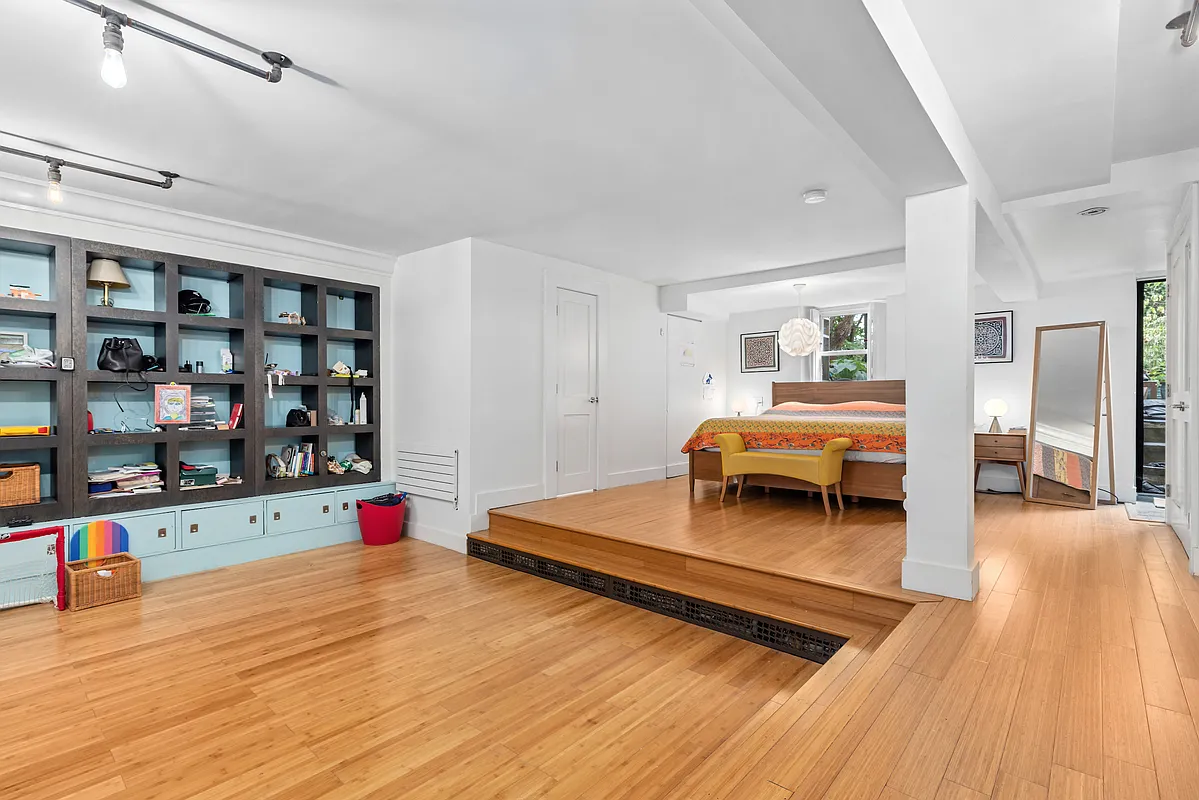 155 Luquer Street, Unit 1 Brooklyn, NY 11231 - Photo 8 of 13 a bedroom with a bed and a wooden floor
