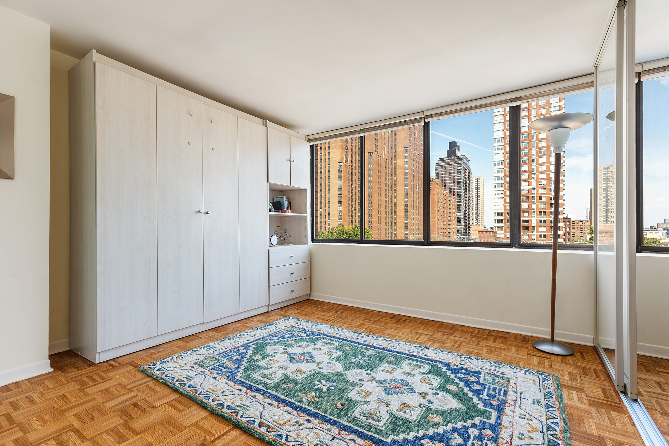300 East 90th Street, Unit 7C Manhattan, NY 10128 - Photo 6 of 12 a view of an empty room and window