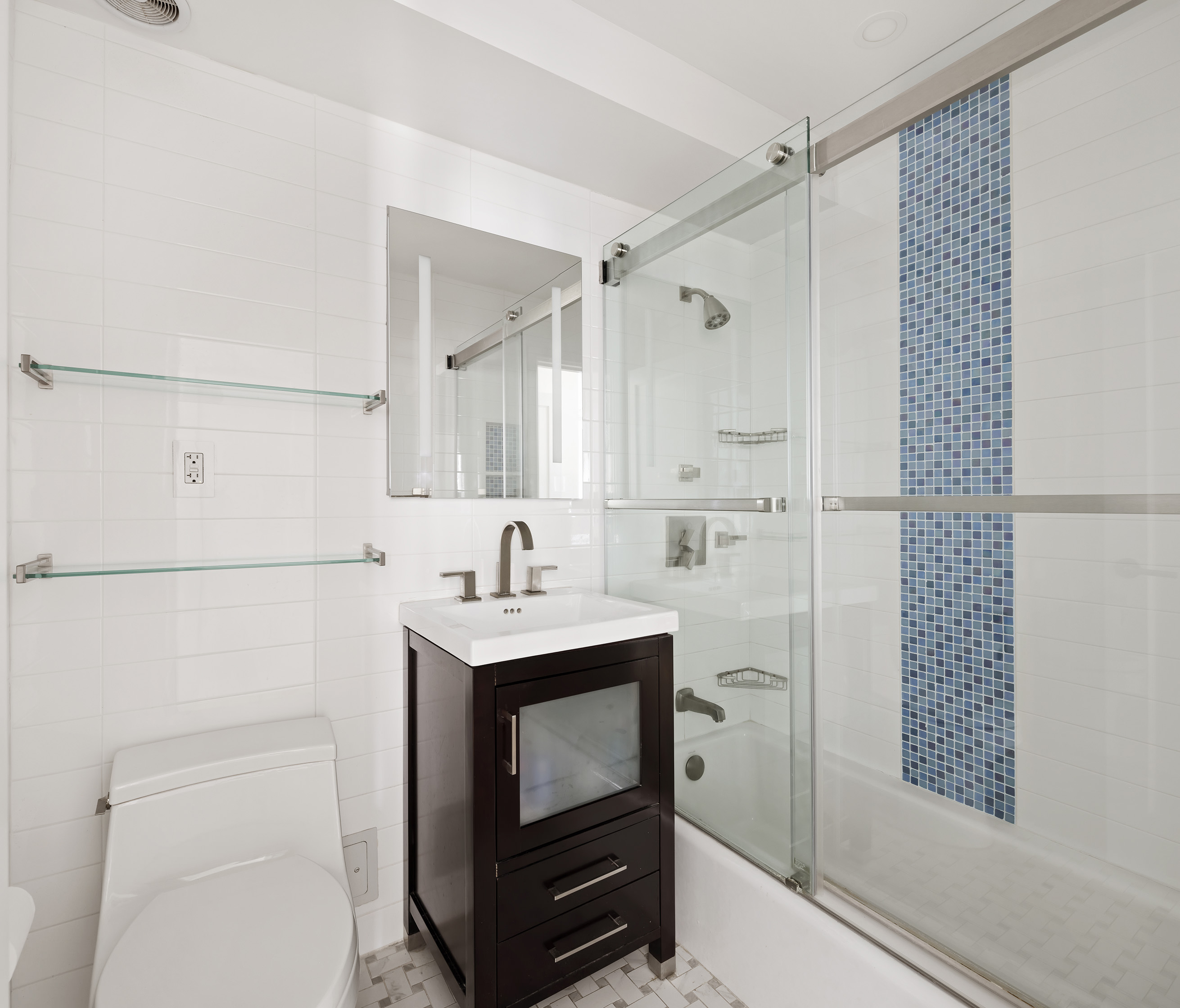 50 East 79th Street, Unit 7B Manhattan, NY 10075 - Photo 8 of 15 a bathroom with a sink a toilet and shower