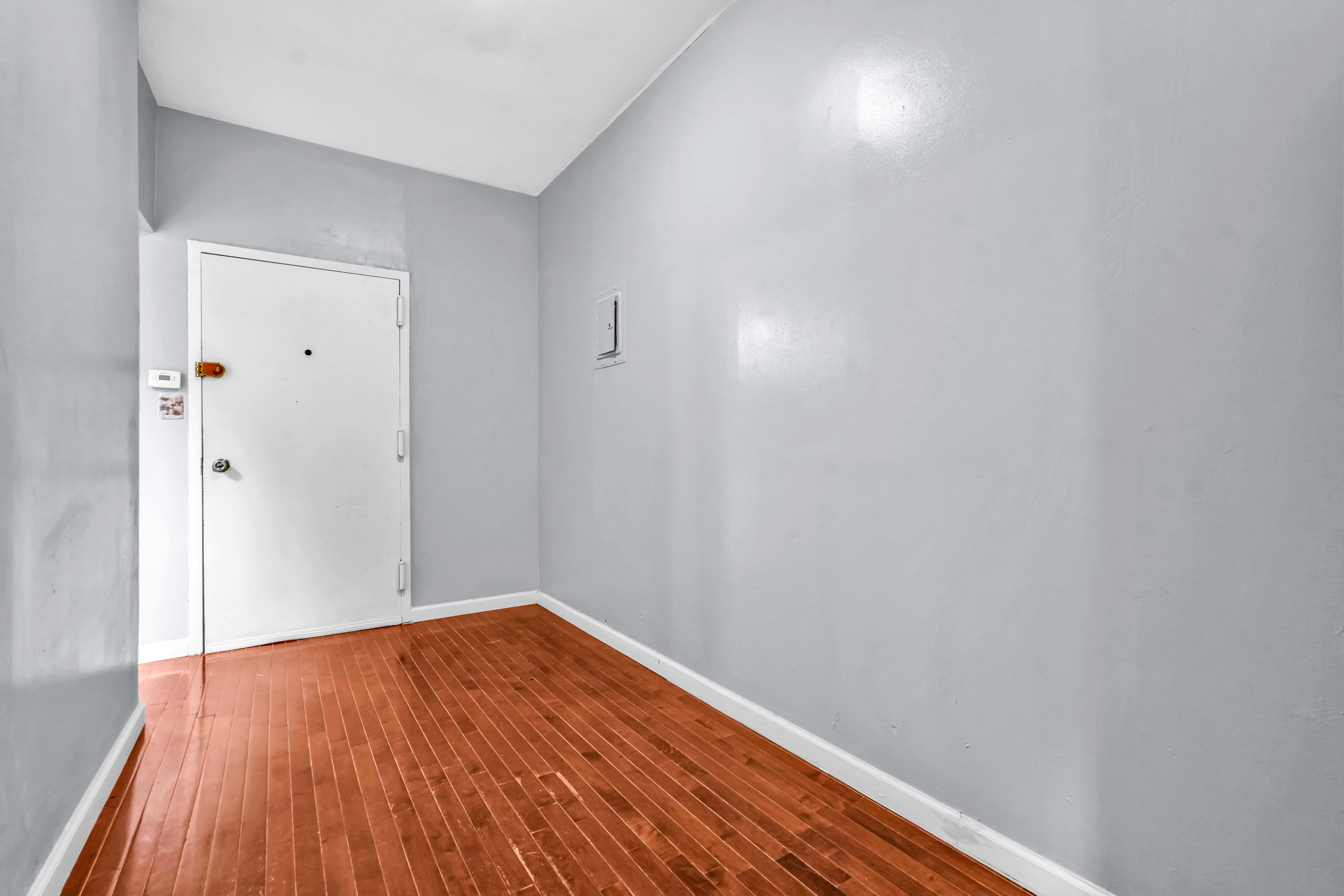 1633 St Johns Place, Unit 3 Brooklyn, NY 11233 - Photo 18 of 29 wooden floor in a hall with an entryway