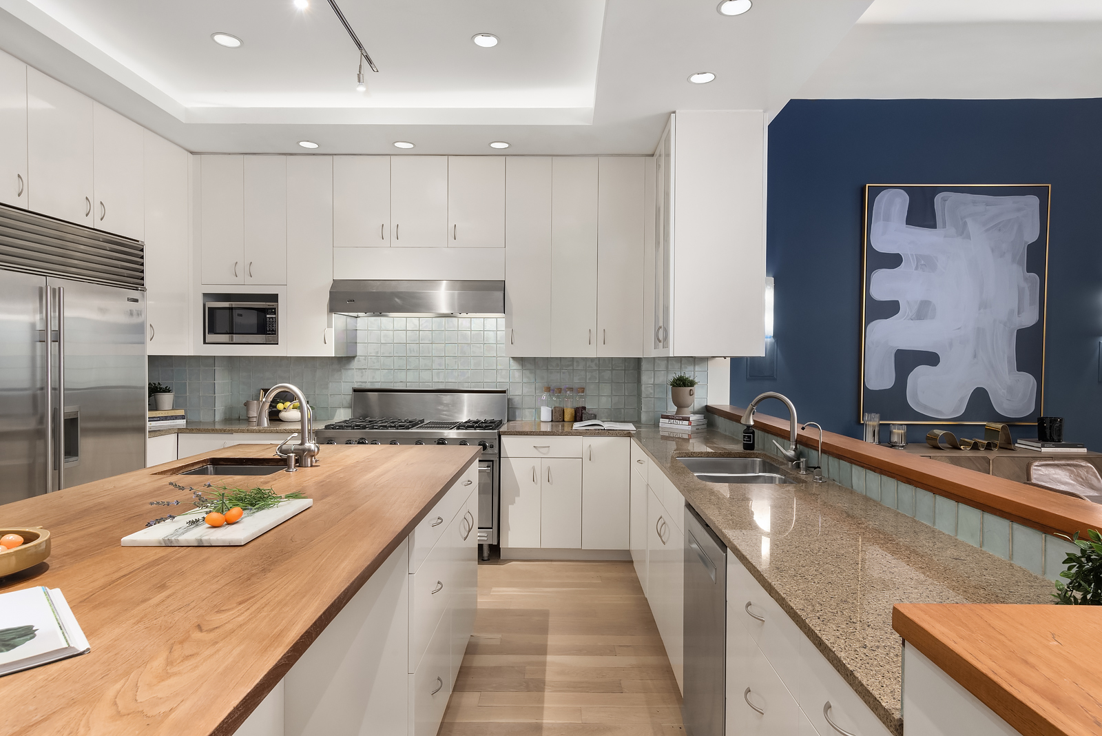 114 Liberty Street, Unit 7 Manhattan, NY 10006 - Photo 6 of 15 a kitchen with a stove a sink a refrigerator and cabinets