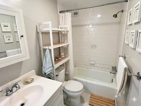 a bathroom with a sink toilet and shower