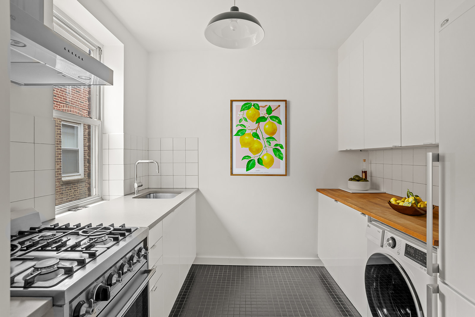 34-43 82nd Street, Unit 51 Queens, NY 11372 - Photo 3 of 12 a kitchen that has a stove and a wooden floor