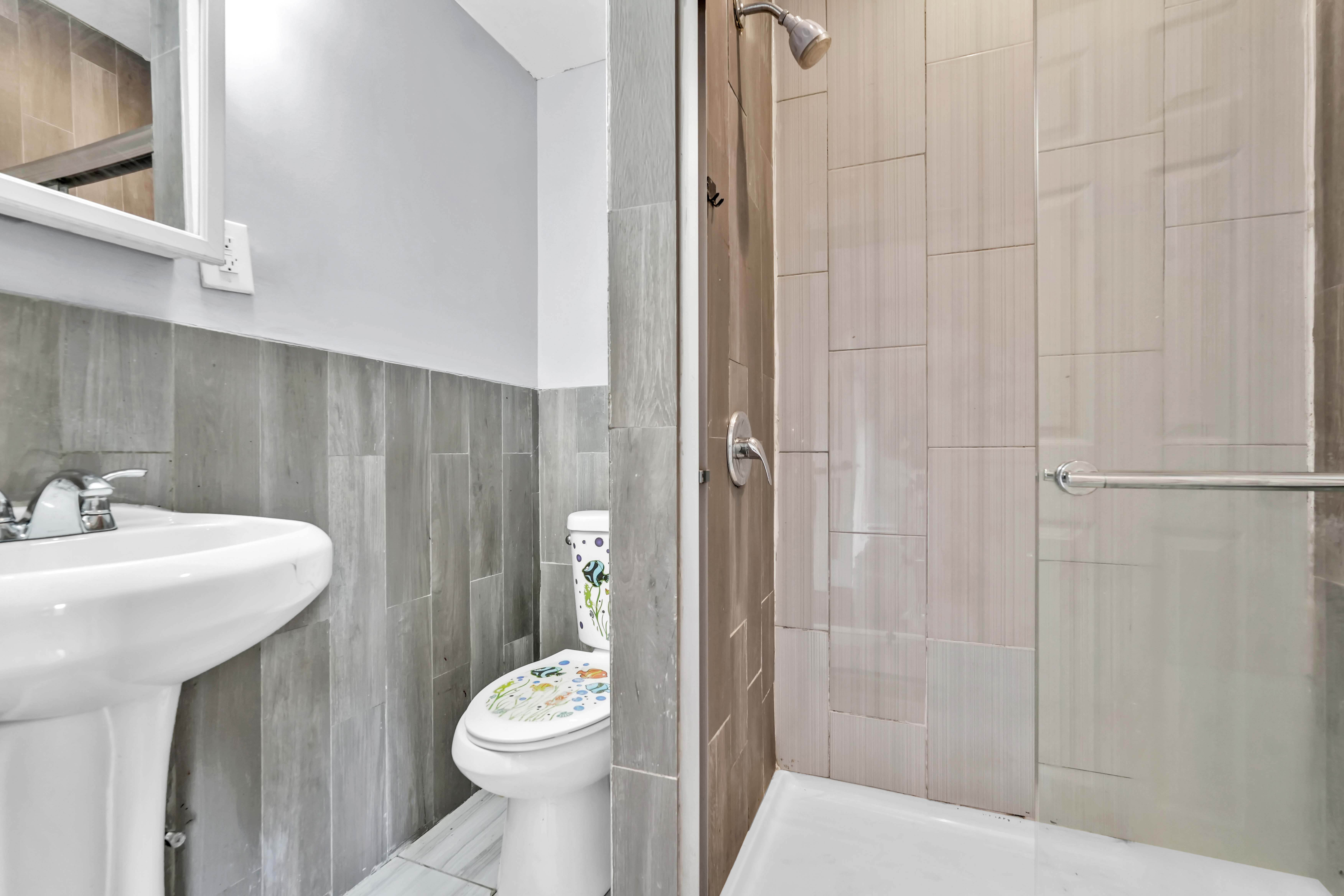 1633 St Johns Place, Unit 3 Brooklyn, NY 11233 - Photo 12 of 29 a bathroom with a sink a toilet and shower