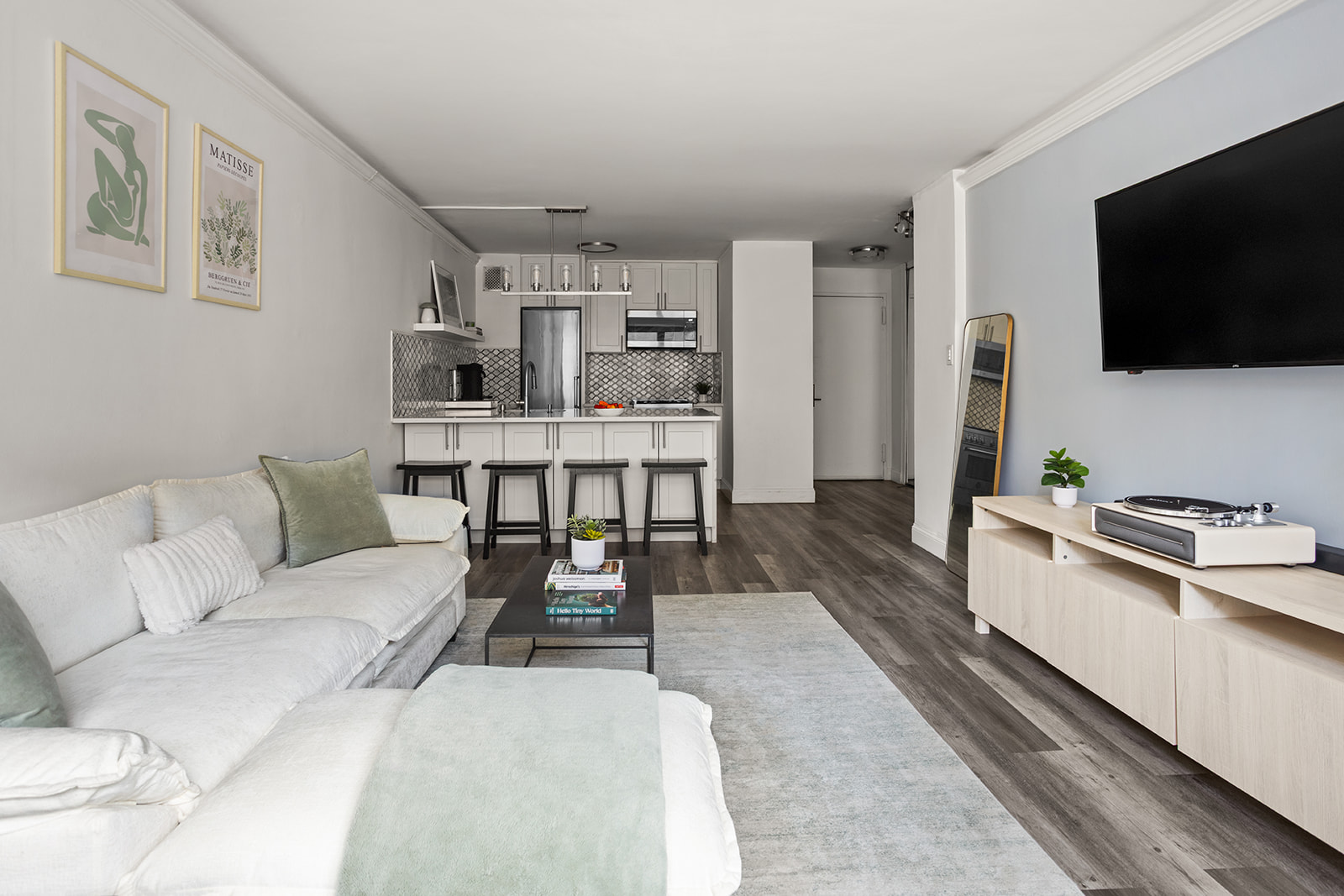 330 3rd Avenue, Unit 3F Manhattan, NY 10010 - Photo 1 of 6 a living room with furniture and a flat screen tv