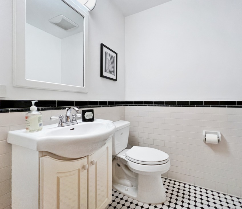 75 Warren Street, Unit 1 Brooklyn, NY 11201 - Photo 12 of 14 a bathroom with a sink a toilet and mirror