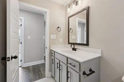 a bathroom with a sink and mirror