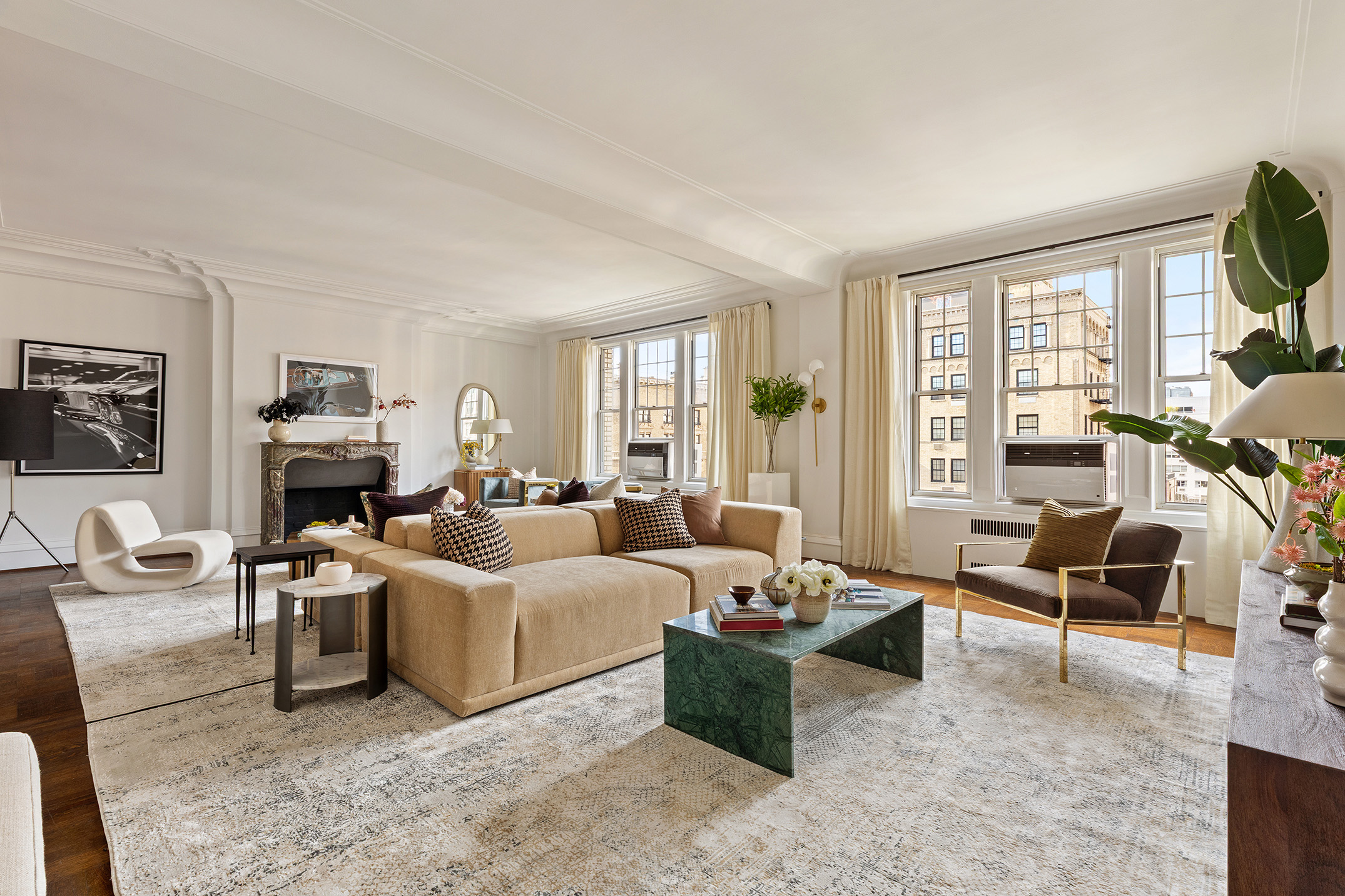 875 Park Avenue, Unit 11C Manhattan, NY 10075 - Photo 2 of 25 a living room with furniture and a large window