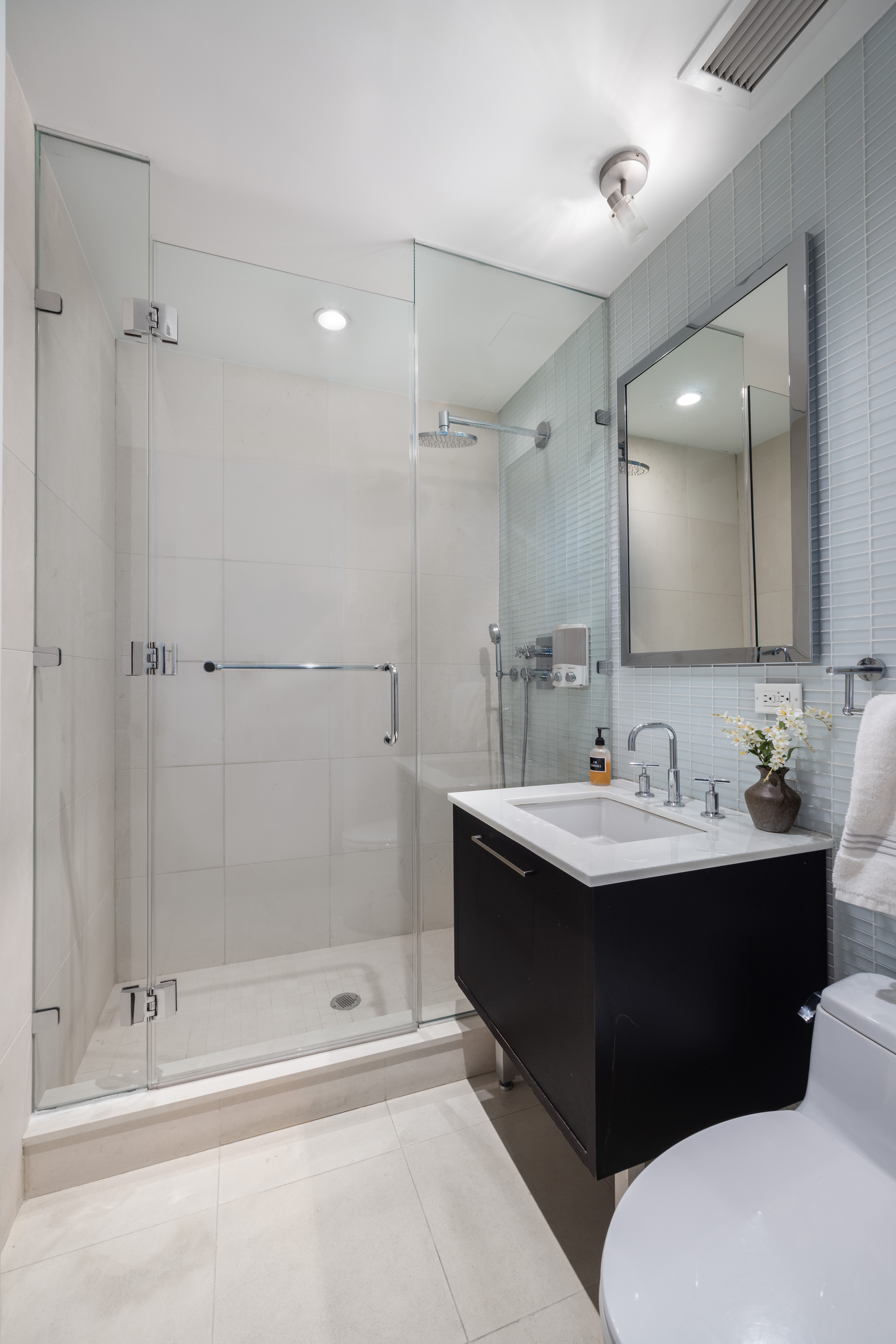 27 West 19th Street, Unit 6 Manhattan, NY 10011 - Photo 9 of 10 a bathroom with a sink and a mirror