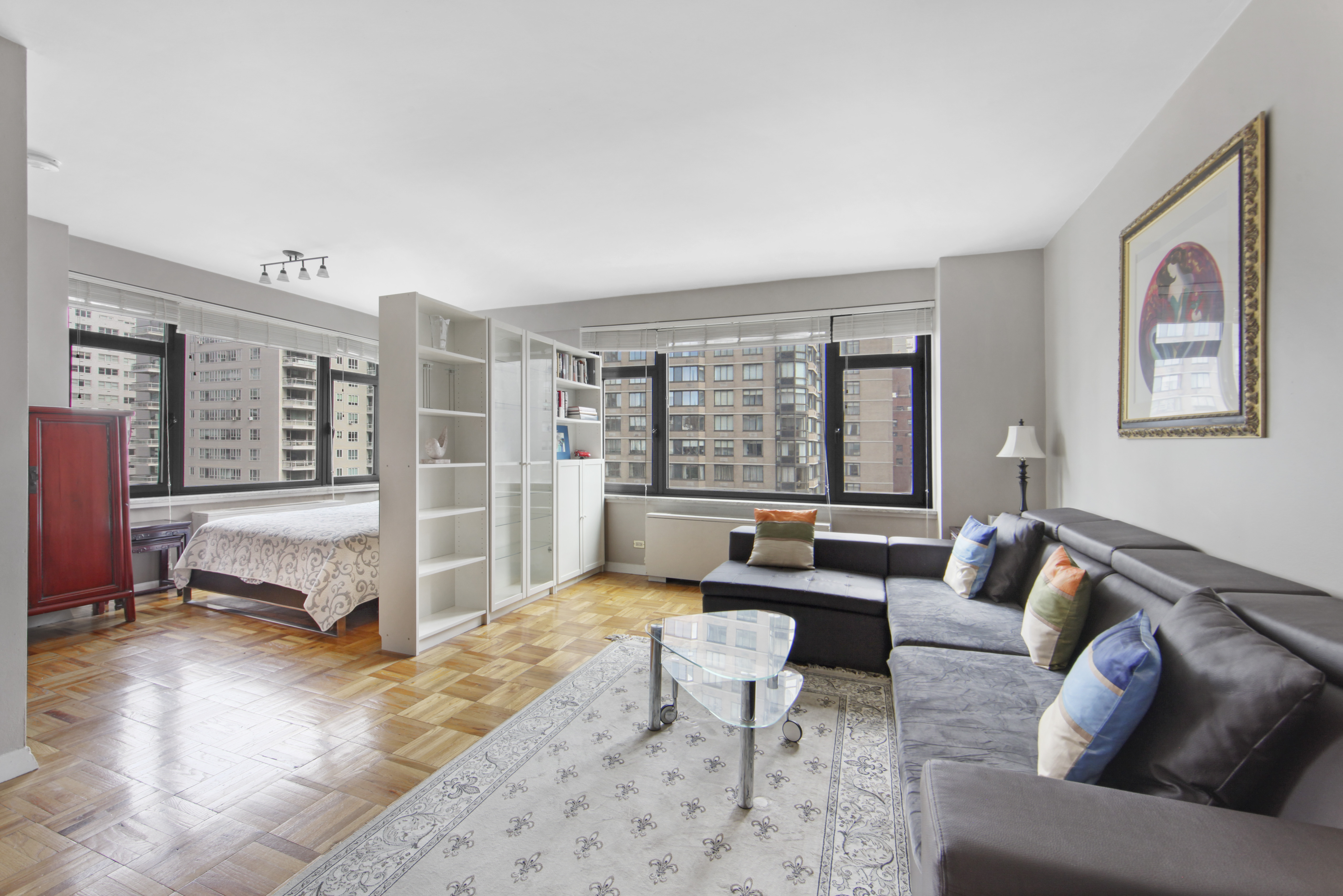 160 East 65th Street, Unit 8A Manhattan, NY 10065 - Photo 2 of 13 a living room with furniture and a large window