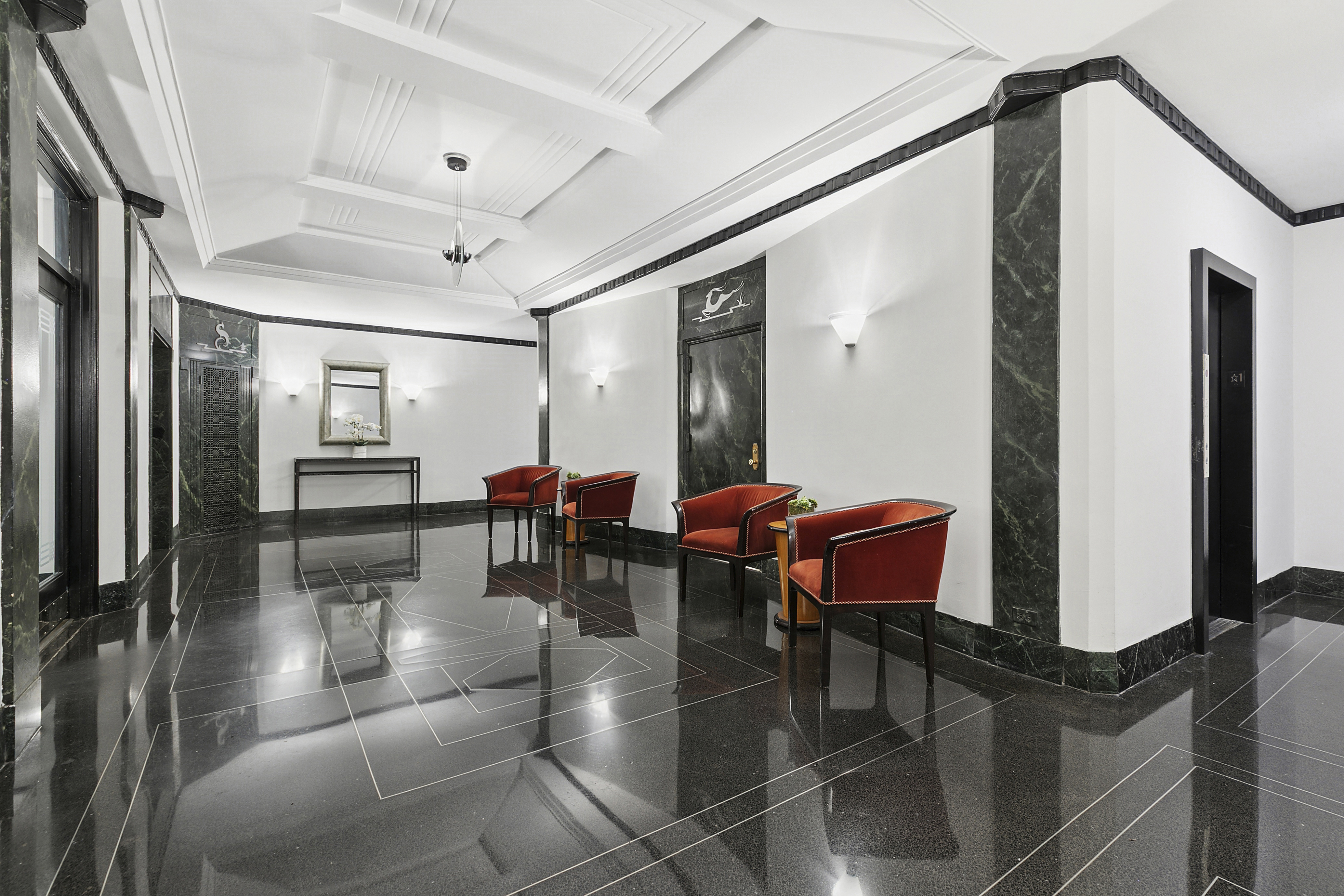 205 East 69th Street, Unit 3A Manhattan, NY 10021 - Photo 10 of 11 a lobby with furniture and rug