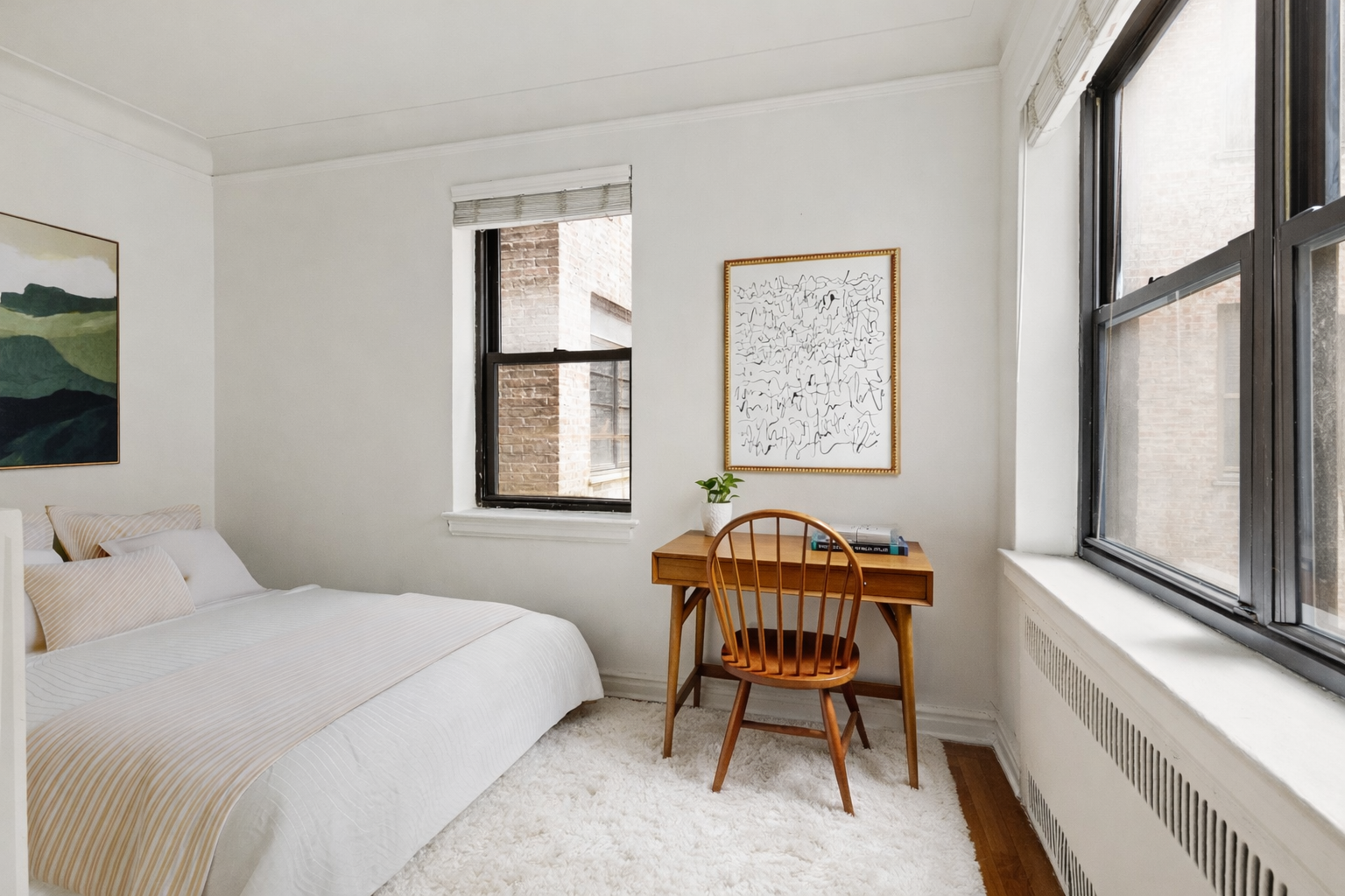 235 Lincoln Place, Unit 2D Brooklyn, NY 11217 - Photo 3 of 6 a bedroom with a bed and a window
