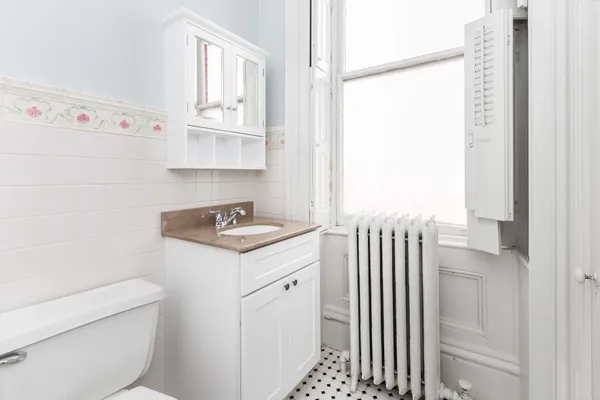 a bathroom with a sink and mirror