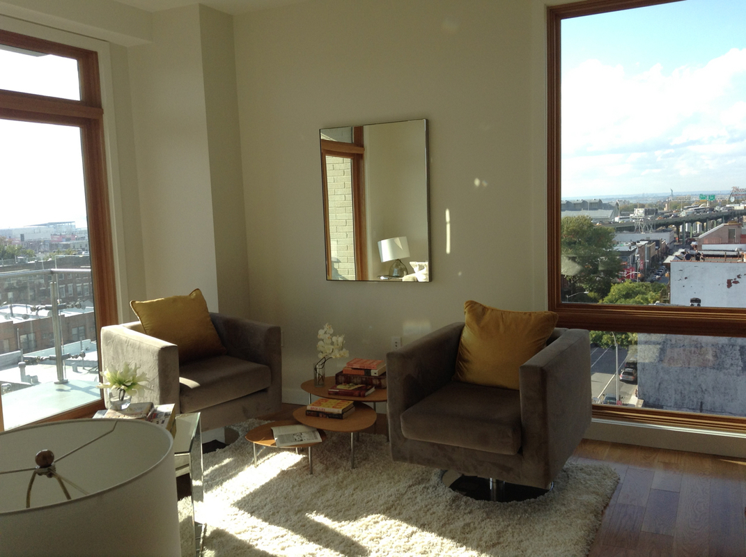 548 4th Avenue, Unit 8A Brooklyn, NY 11215 - Photo 5 of 21 a living room with furniture and a floor to ceiling window