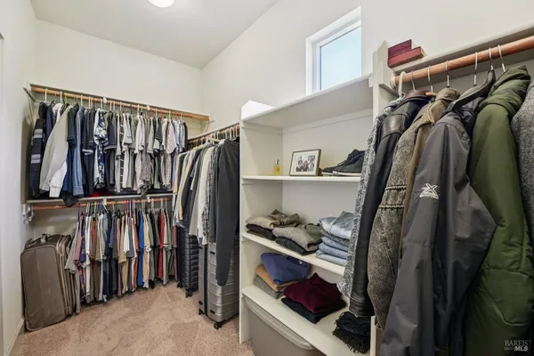 a bathroom with a double vanity sink toilet and a mirror