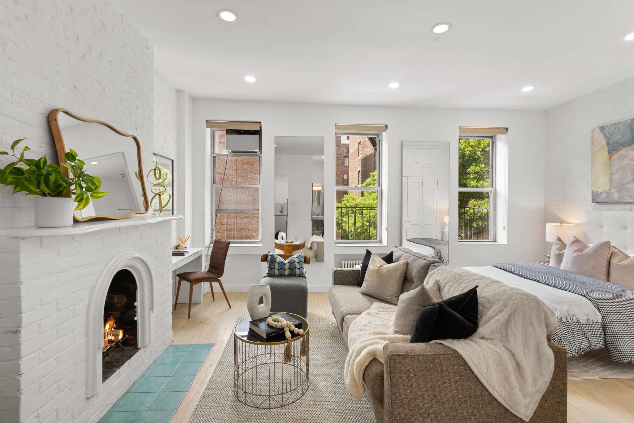 237 East 12th Street, Unit 2A Manhattan, NY 10003 - Photo 1 of 16 a living room with furniture and a fireplace