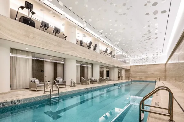 a view of swimming pool with outdoor seating
