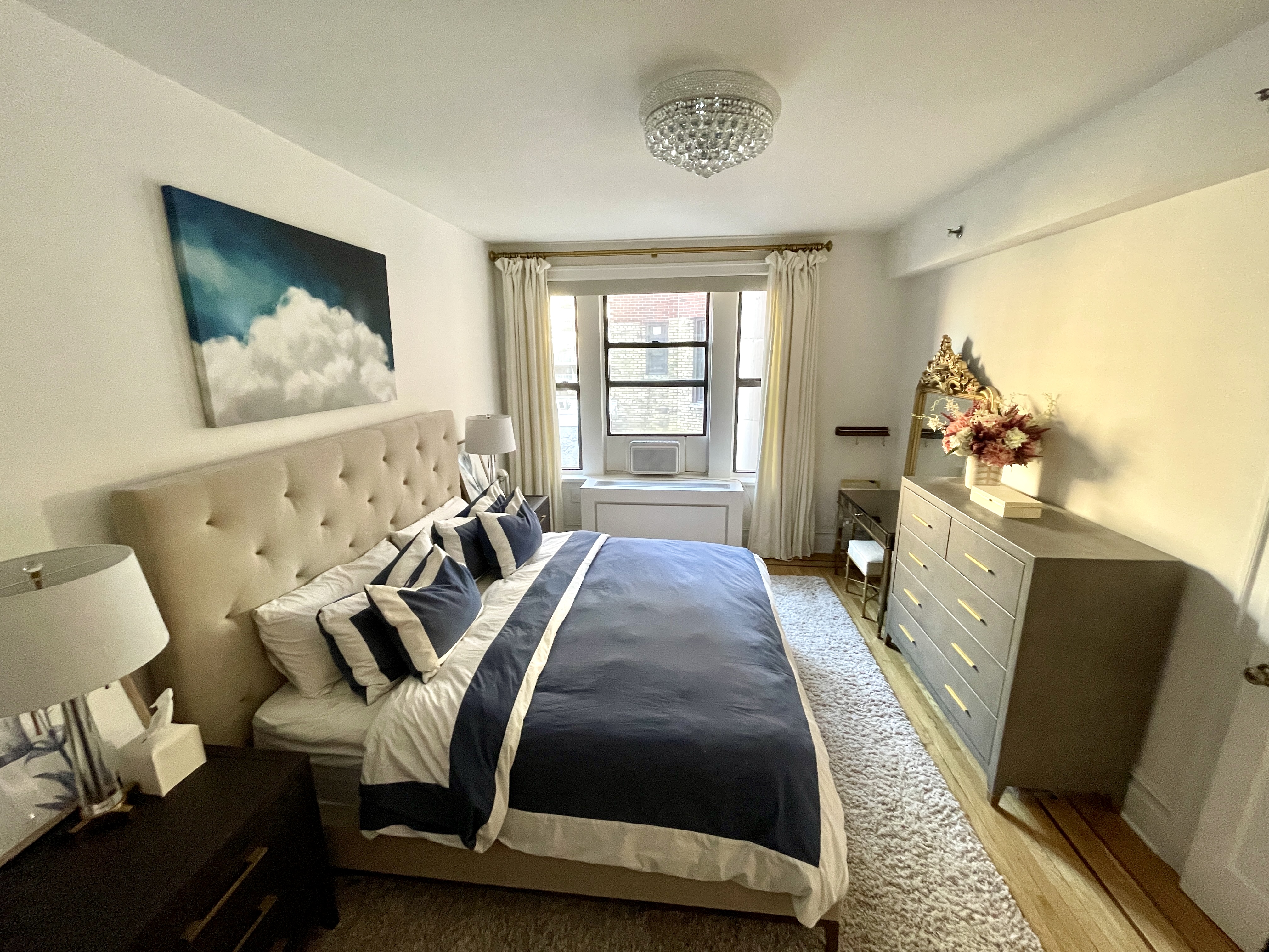 203 West 90th Street, Unit 6B Manhattan, NY 10024 - Photo 21 of 22 a living room with furniture and a flat screen tv