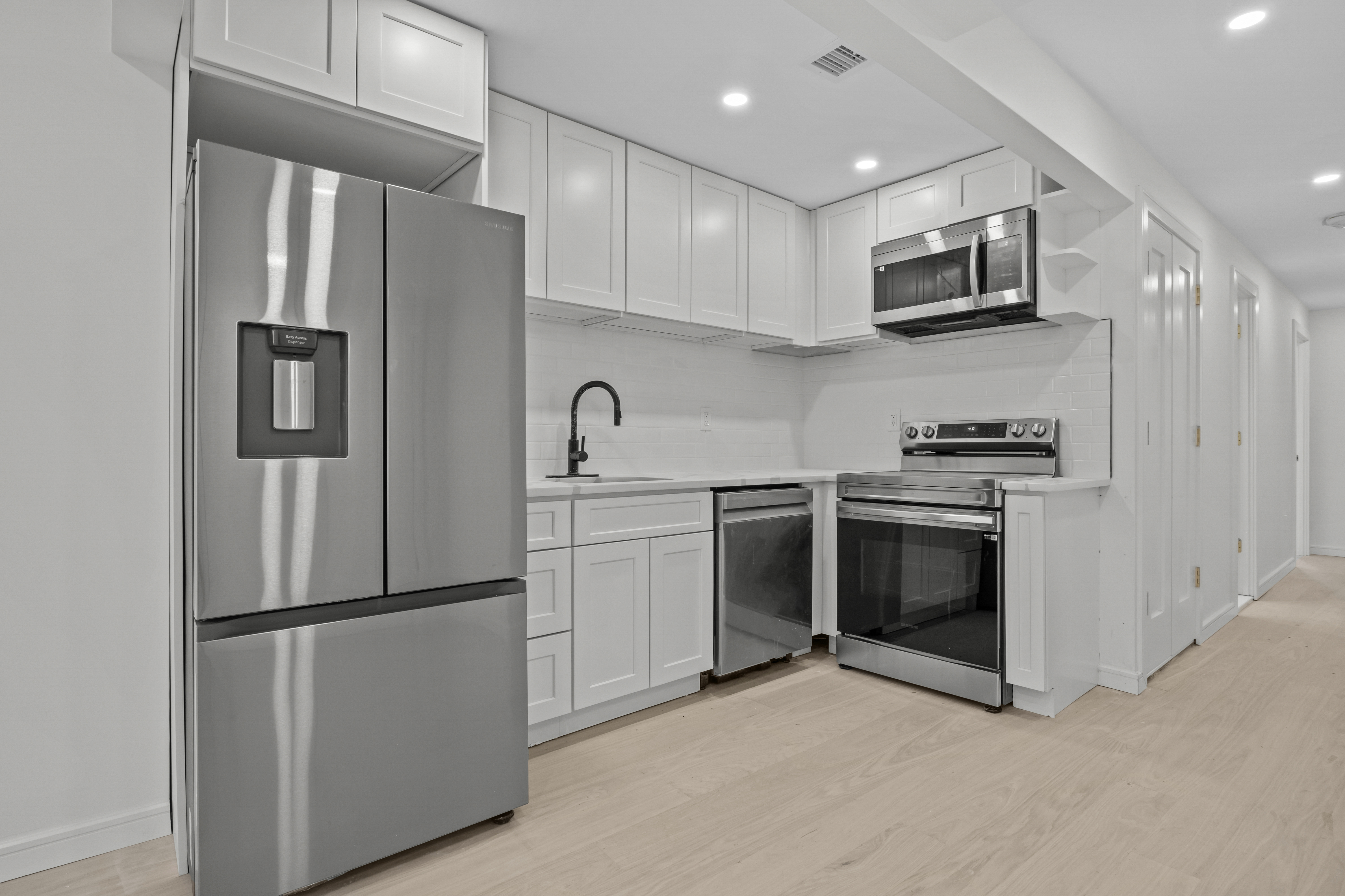 320 10th Street Brooklyn, NY 11215 - Photo 25 of 41 a kitchen with stainless steel appliances a refrigerator sink and microwave
