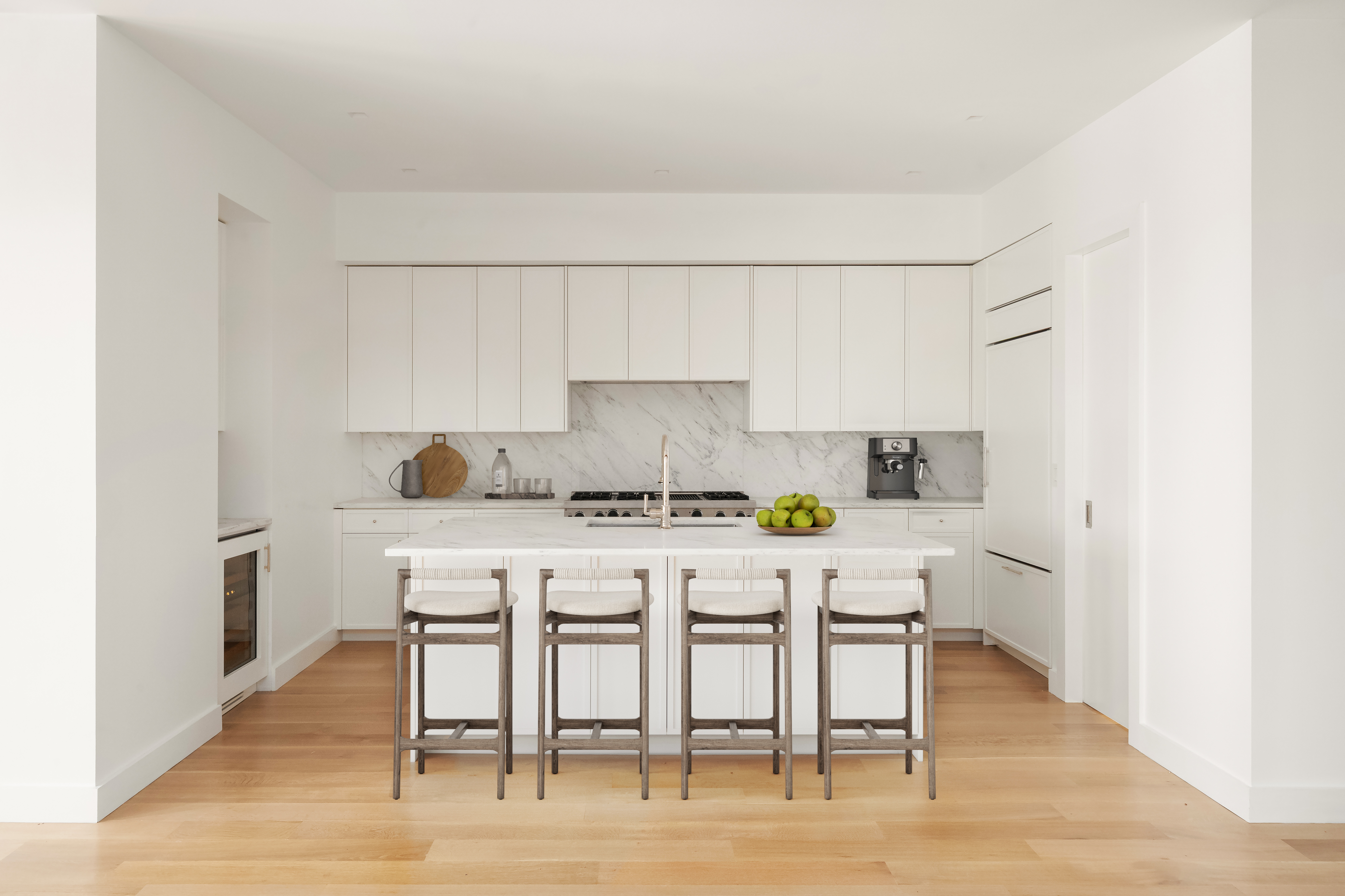 243 West Broadway, Unit 4 Manhattan, NY 10013 - Photo 5 of 12 a kitchen with stainless steel appliances a table and chairs in it
