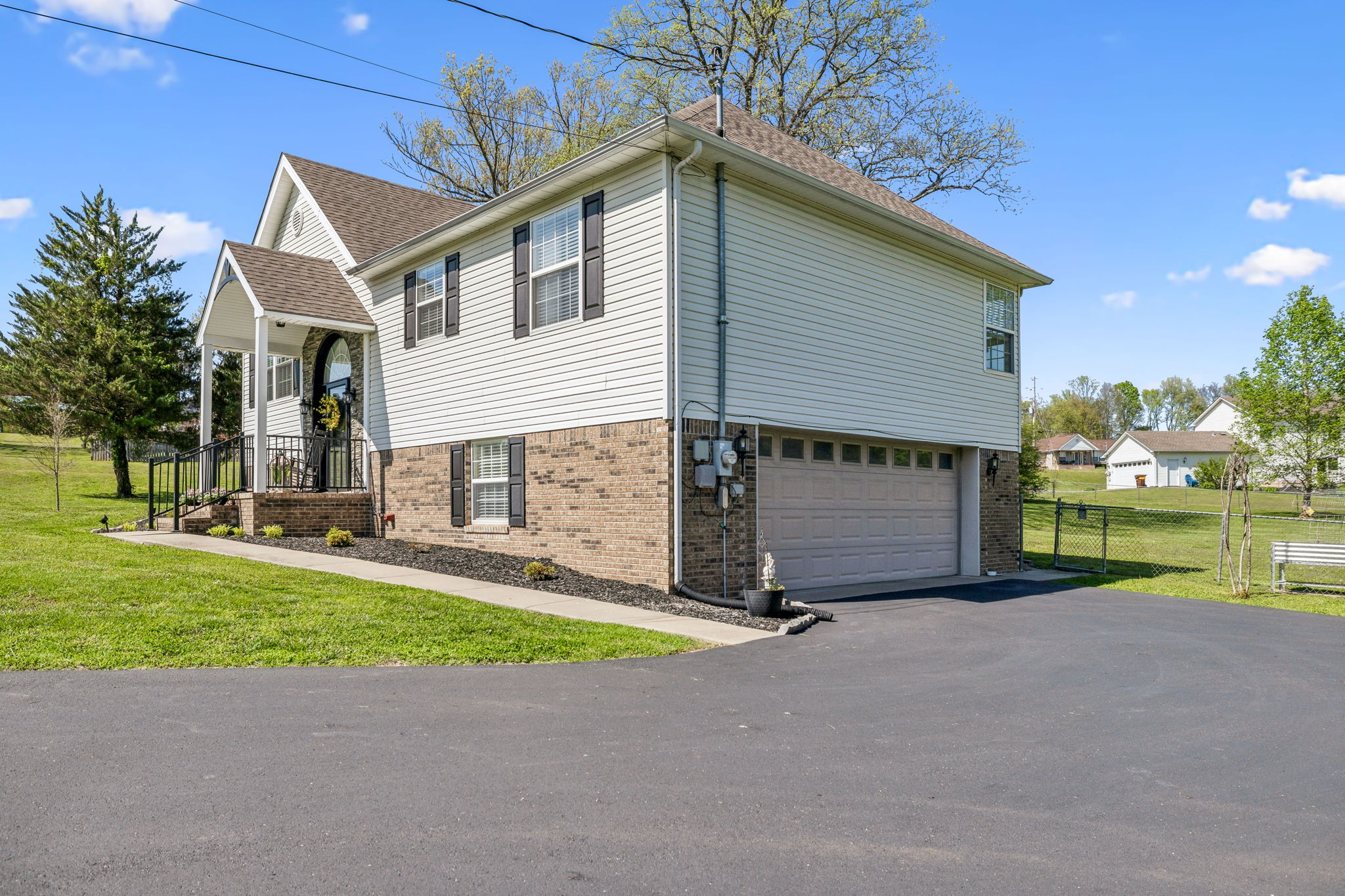 405 Billy Lane Spring Hill, TN 37174 - Photo 5 of 39 a view of a house with a yard and a garage