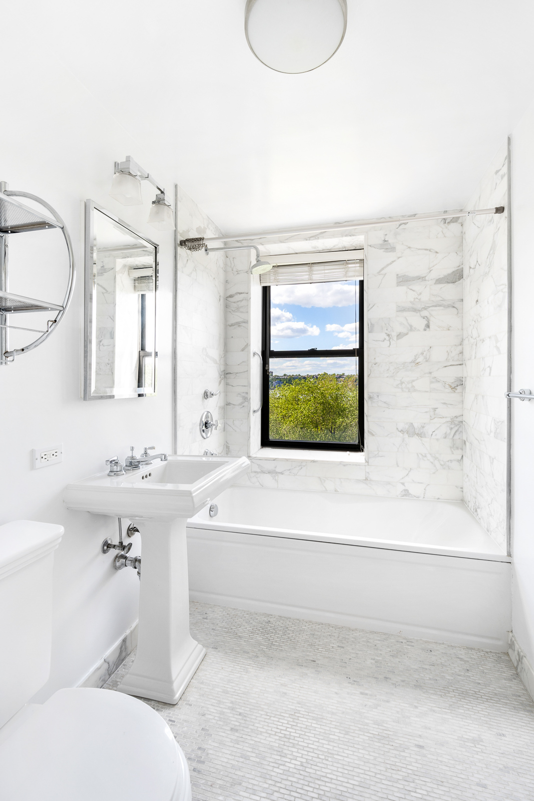 230 Riverside Drive, Unit 8C Manhattan, NY 10025 - Photo 5 of 10 a bathroom with a sink and a bathtub