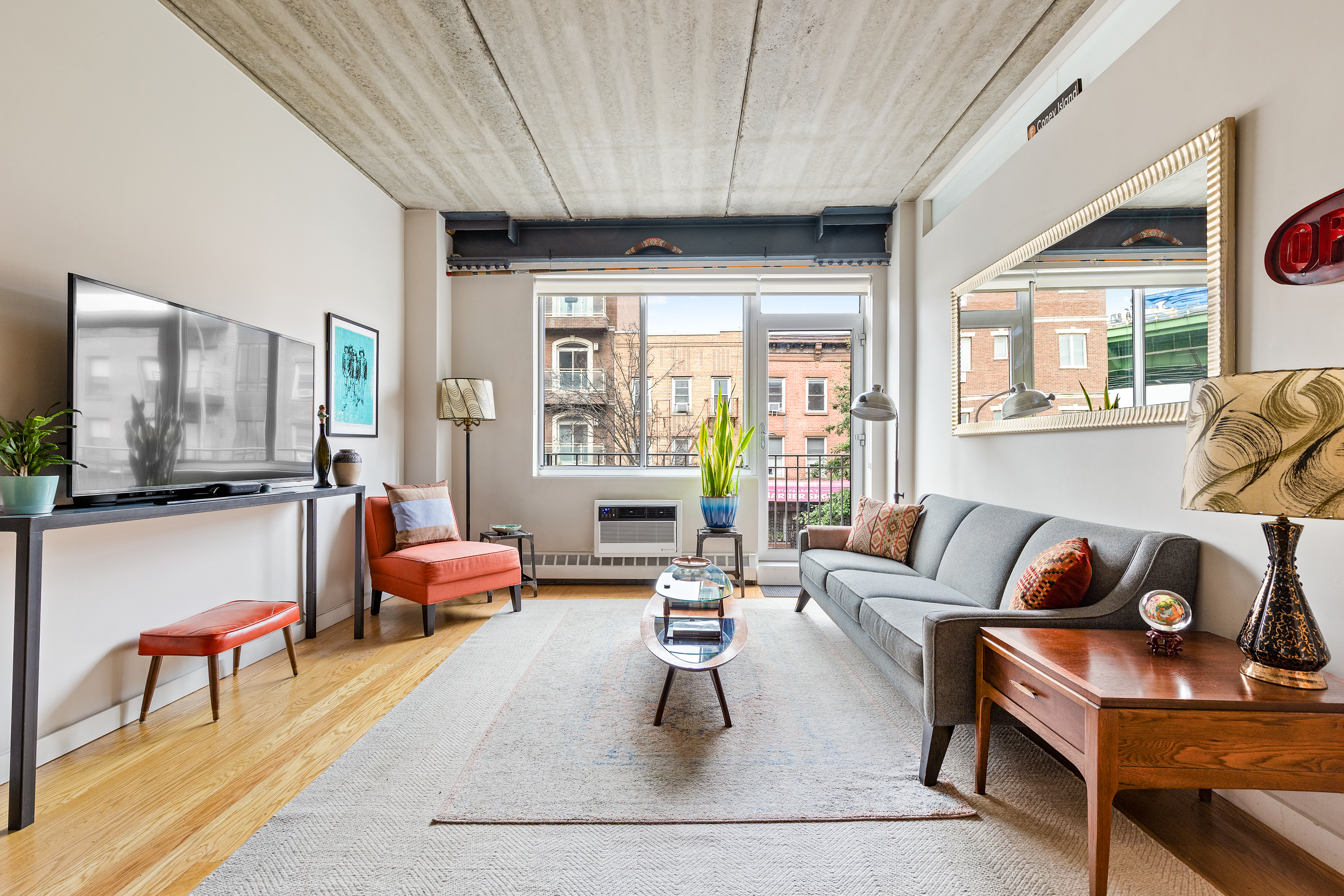 a living room with furniture and a large window