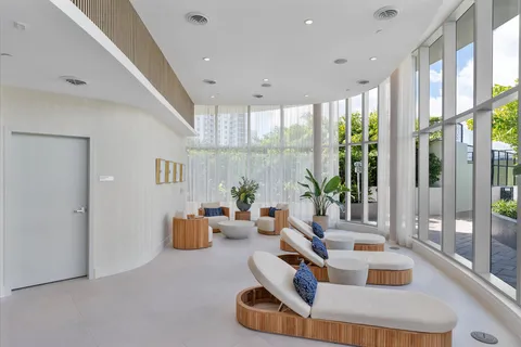 a room with furniture and a large window