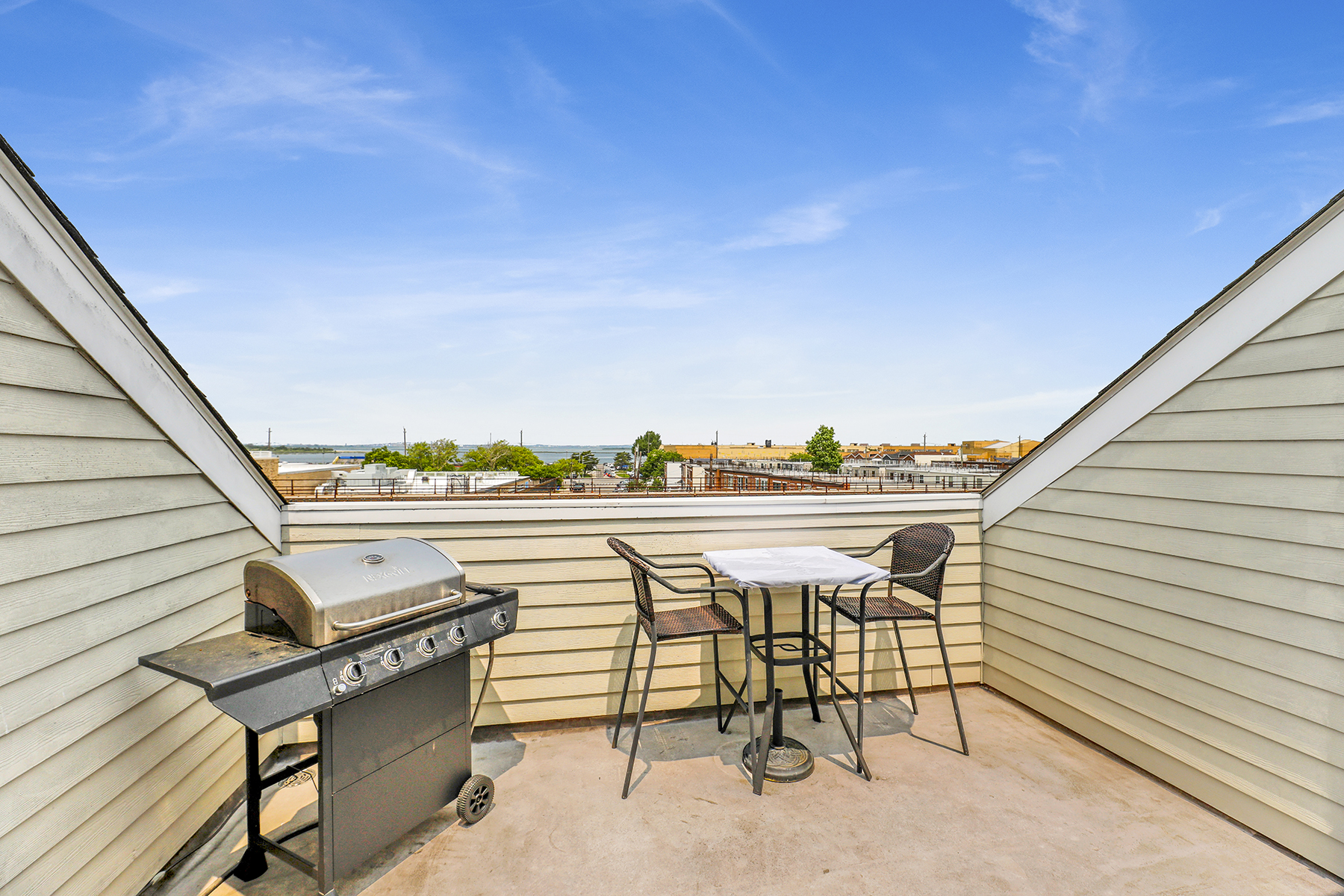 102-20 Rockaway Beach Boulevard, Unit 3C Queens, NY 11694 - Photo 30 of 36 a view of a terrace with furniture and a potted plant