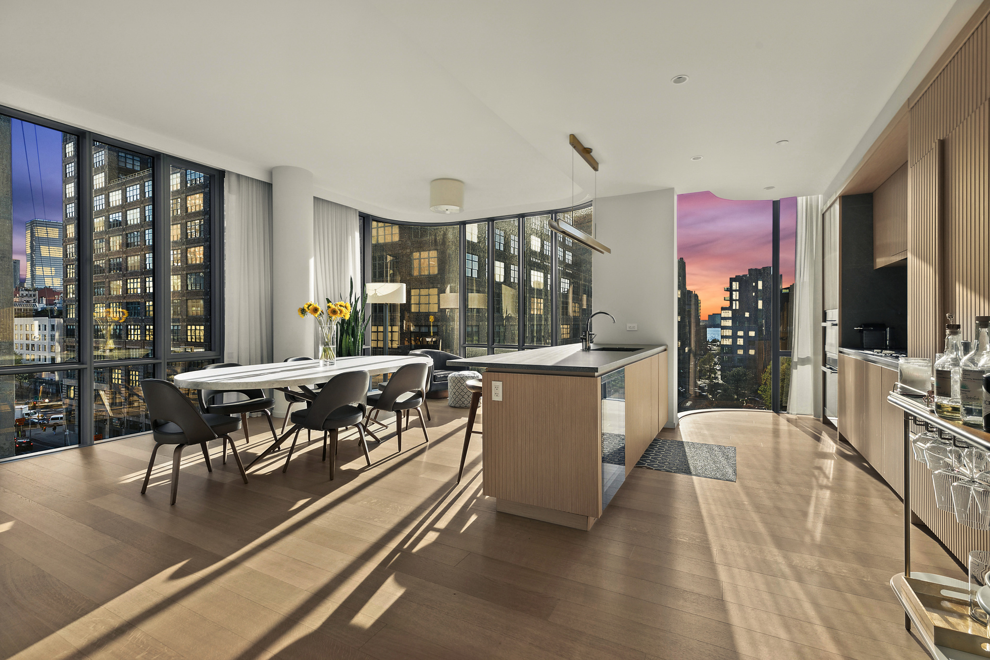 565 Broome Street, Unit S8C Manhattan, NY 10013 - Photo 5 of 24 a living room with furniture large window and wooden floor