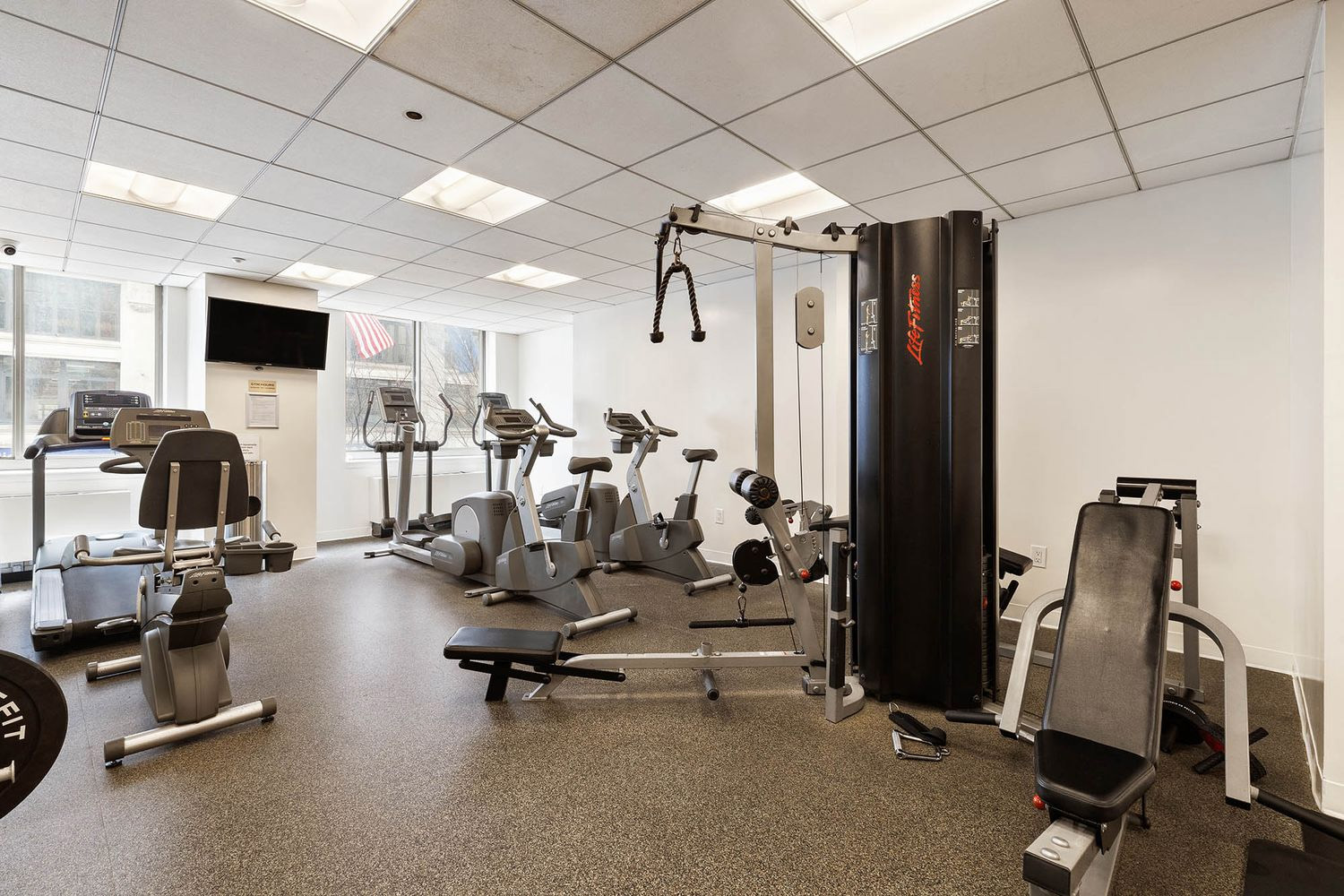 121 East 23rd Street, Unit 4H Manhattan, NY 10010 - Photo 7 of 12 a view of a room with gym equipment