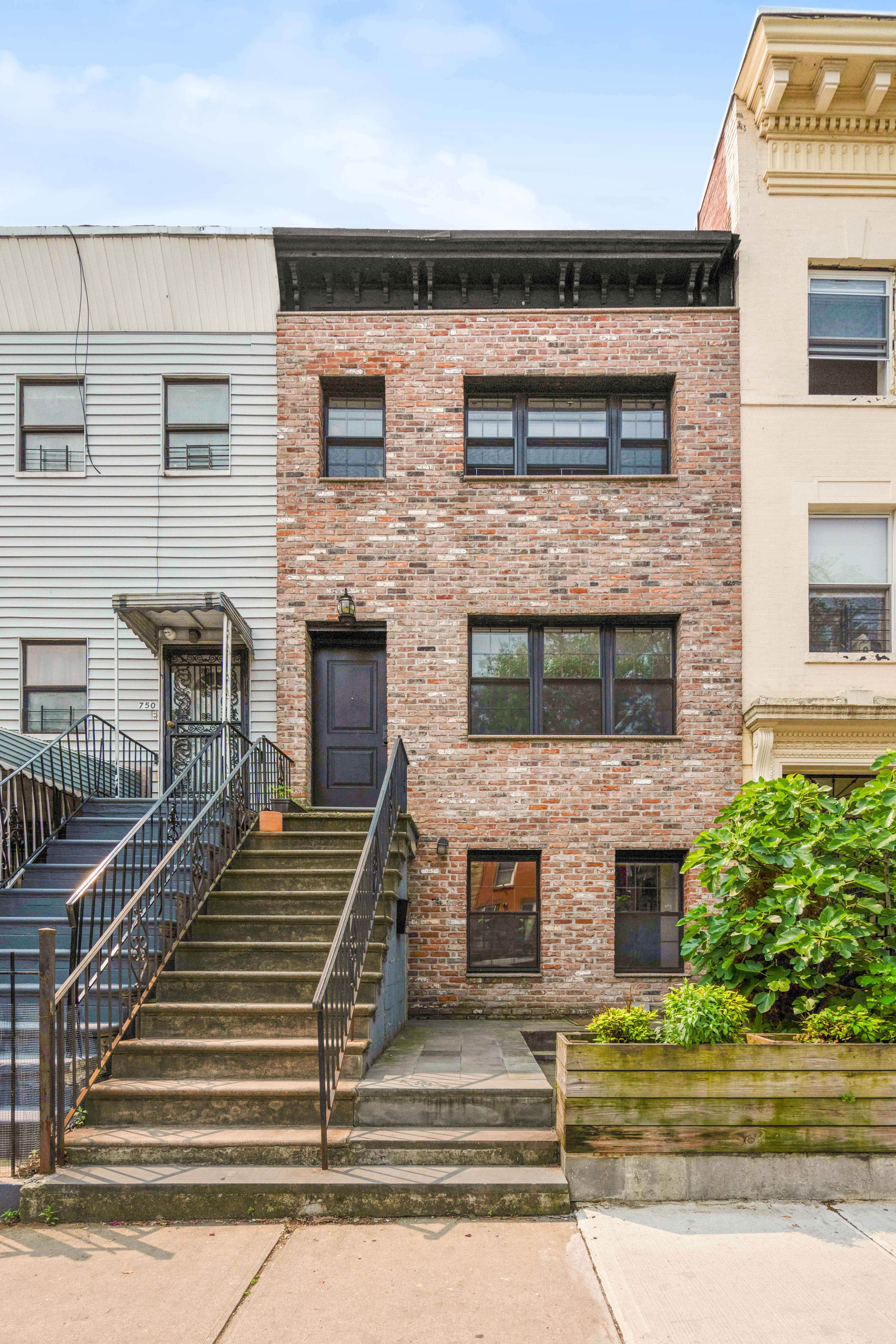748 Madison Street, Unit 1 Brooklyn, NY 11221 - Photo 9 of 10 a front view of a house with stairs