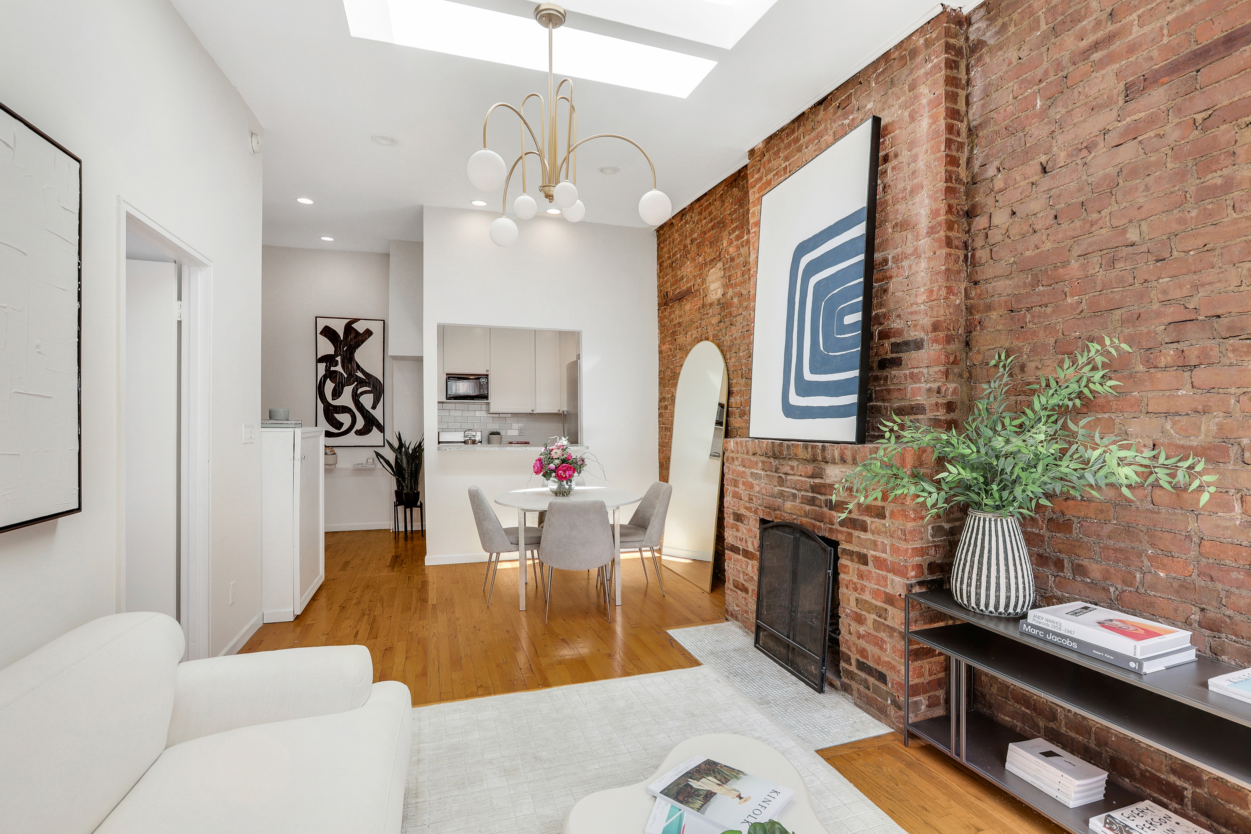 304 West 88th Street, Unit 4B Manhattan, NY 10024 - Photo 3 of 8 a living room with furniture fireplace and flat screen tv