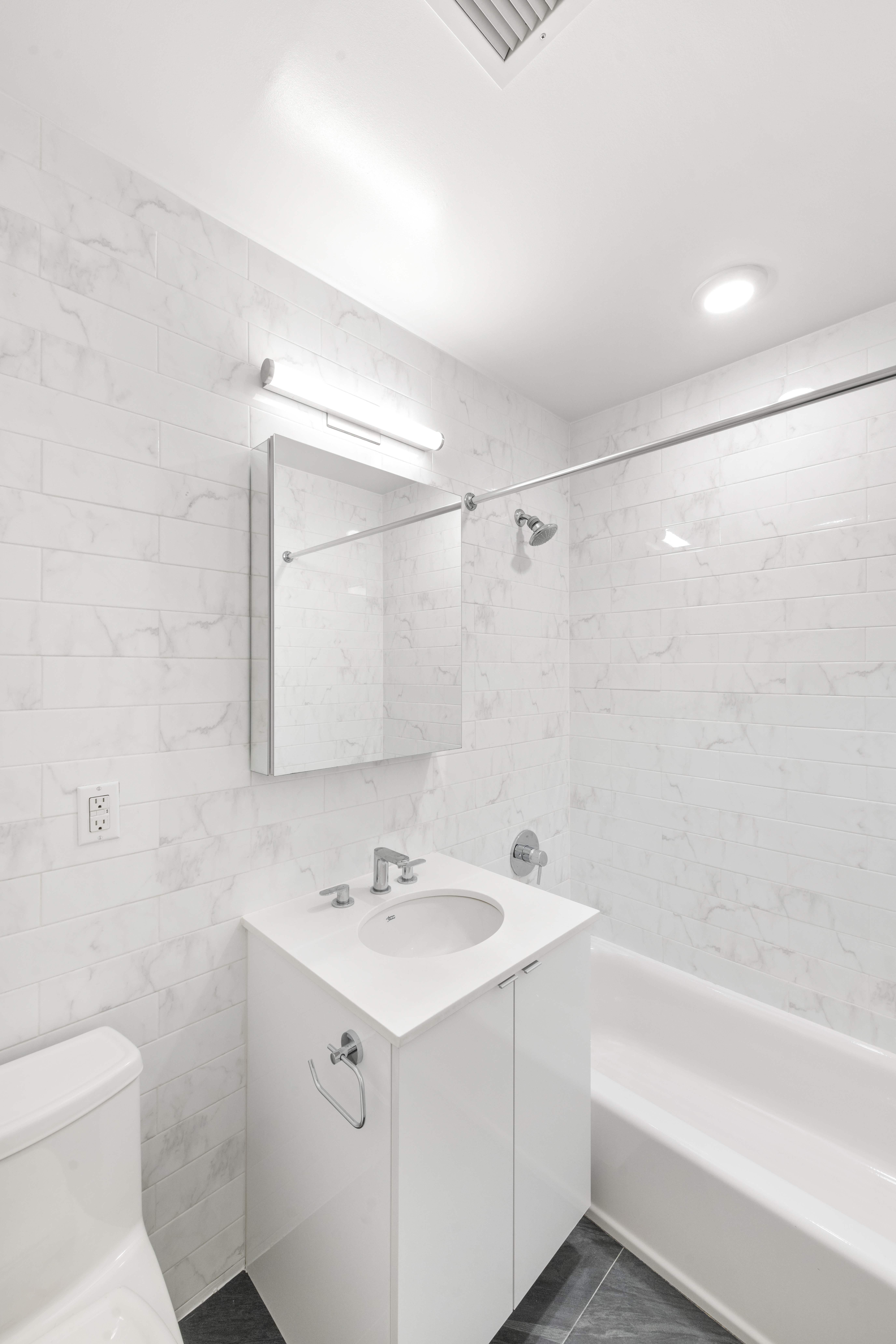 1164 Greene Avenue, Unit PHA Brooklyn, NY 11221 - Photo 8 of 13 a bathroom with a sink mirror vanity and toilet