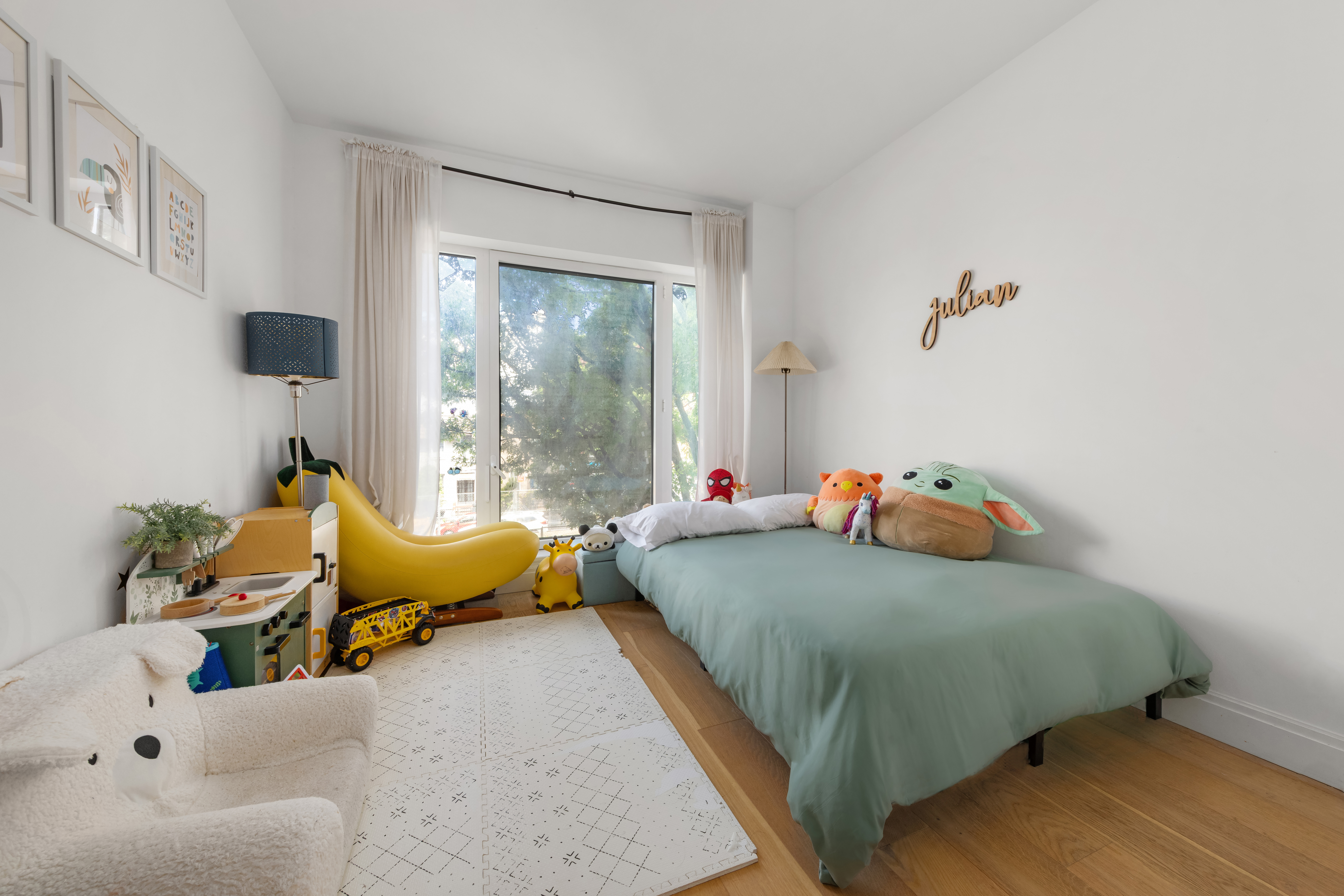 181 18th Street, Unit 204 Brooklyn, NY 11215 - Photo 5 of 15 a bedroom with a bed and a couch