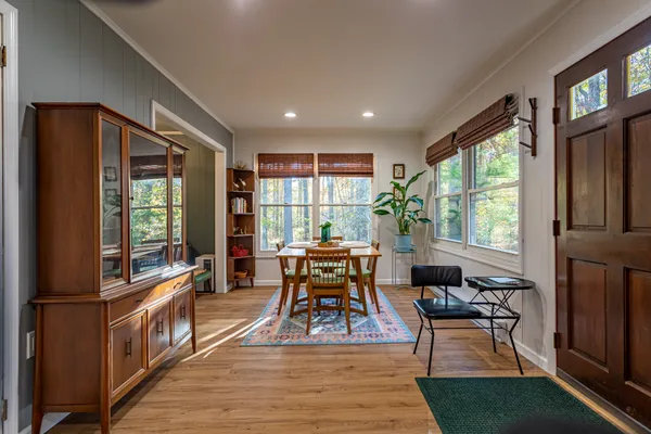 a living room with furniture a window and a flat screen tv