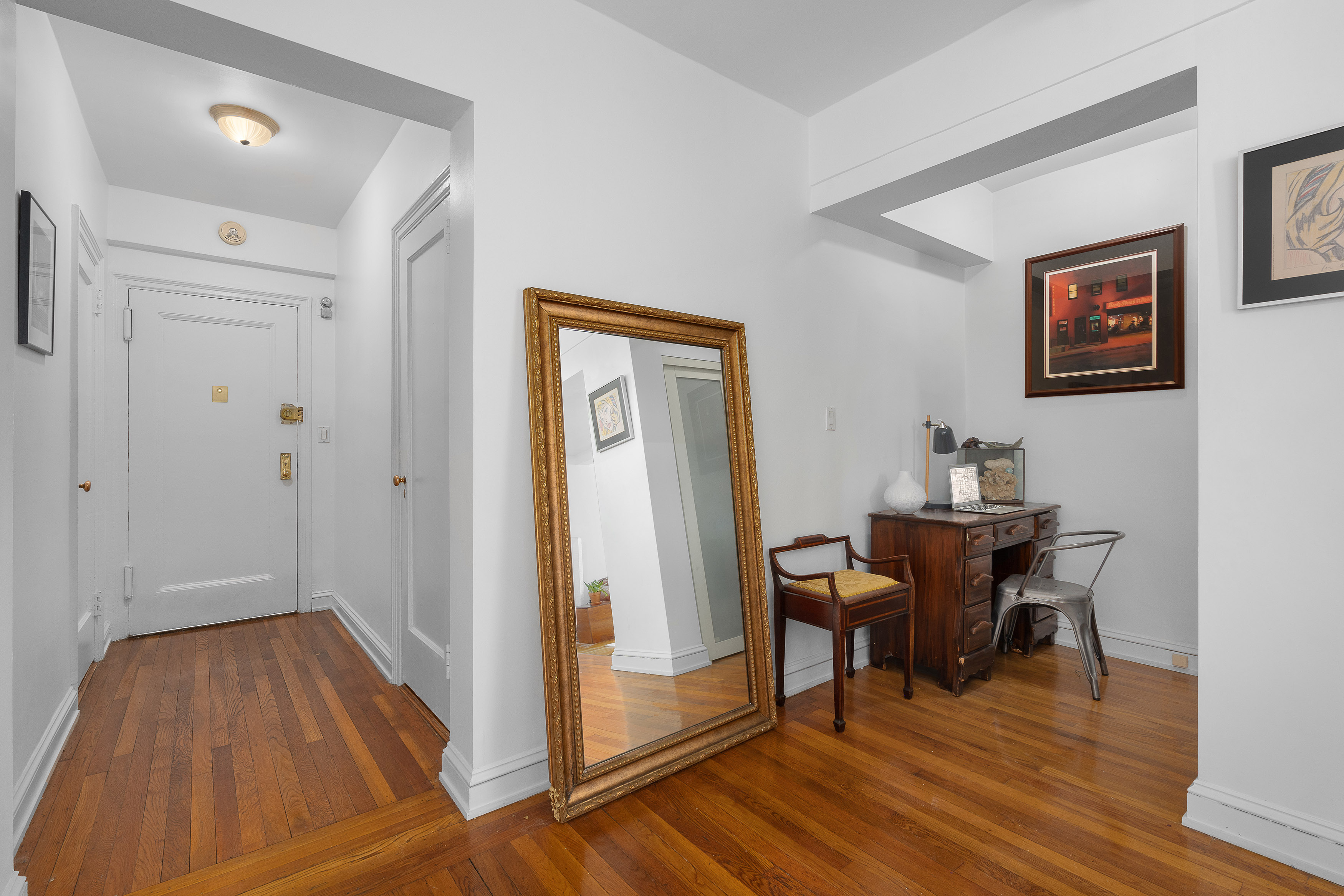 400 East 52nd Street, Unit 7A Manhattan, NY 10022 - Photo 7 of 9 a view of a room with wooden floor and furniture