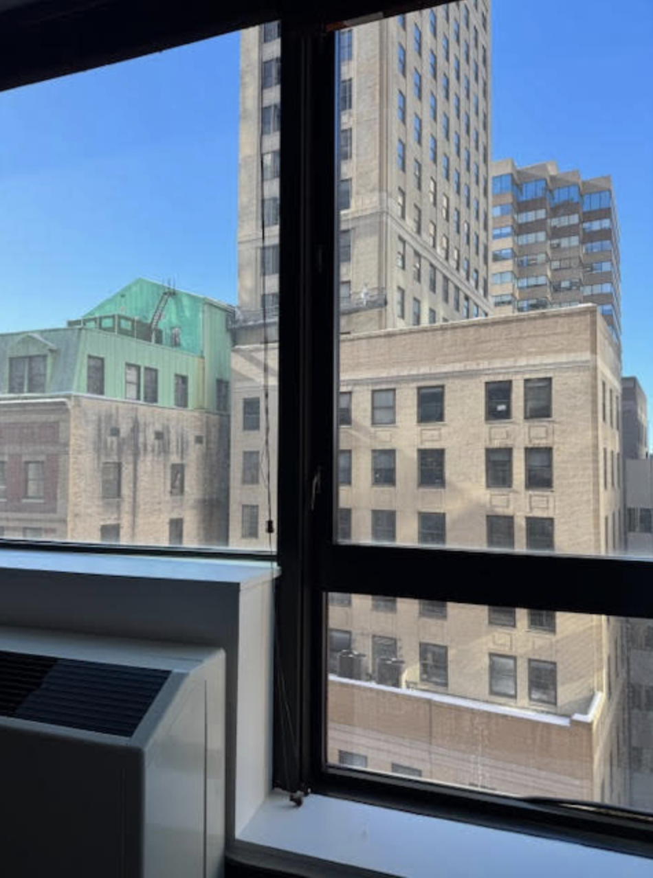 40 Broad Street, Unit 25C Manhattan, NY 10004 - Photo 3 of 10 a view of a building from a window