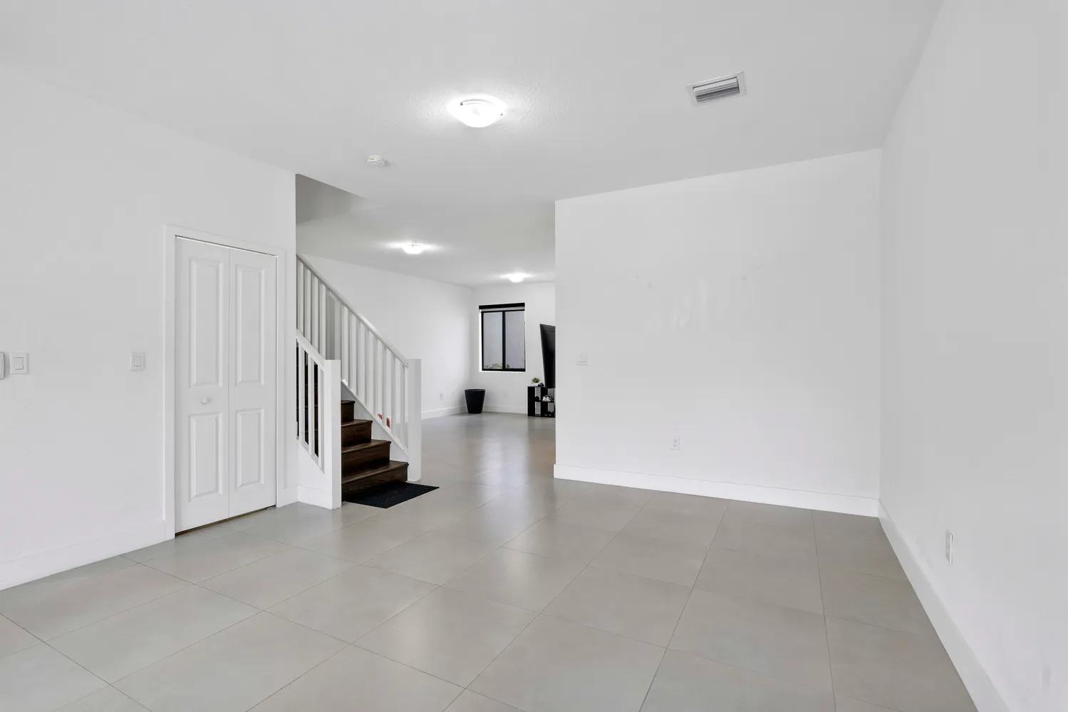 a view of a hallway with seating space