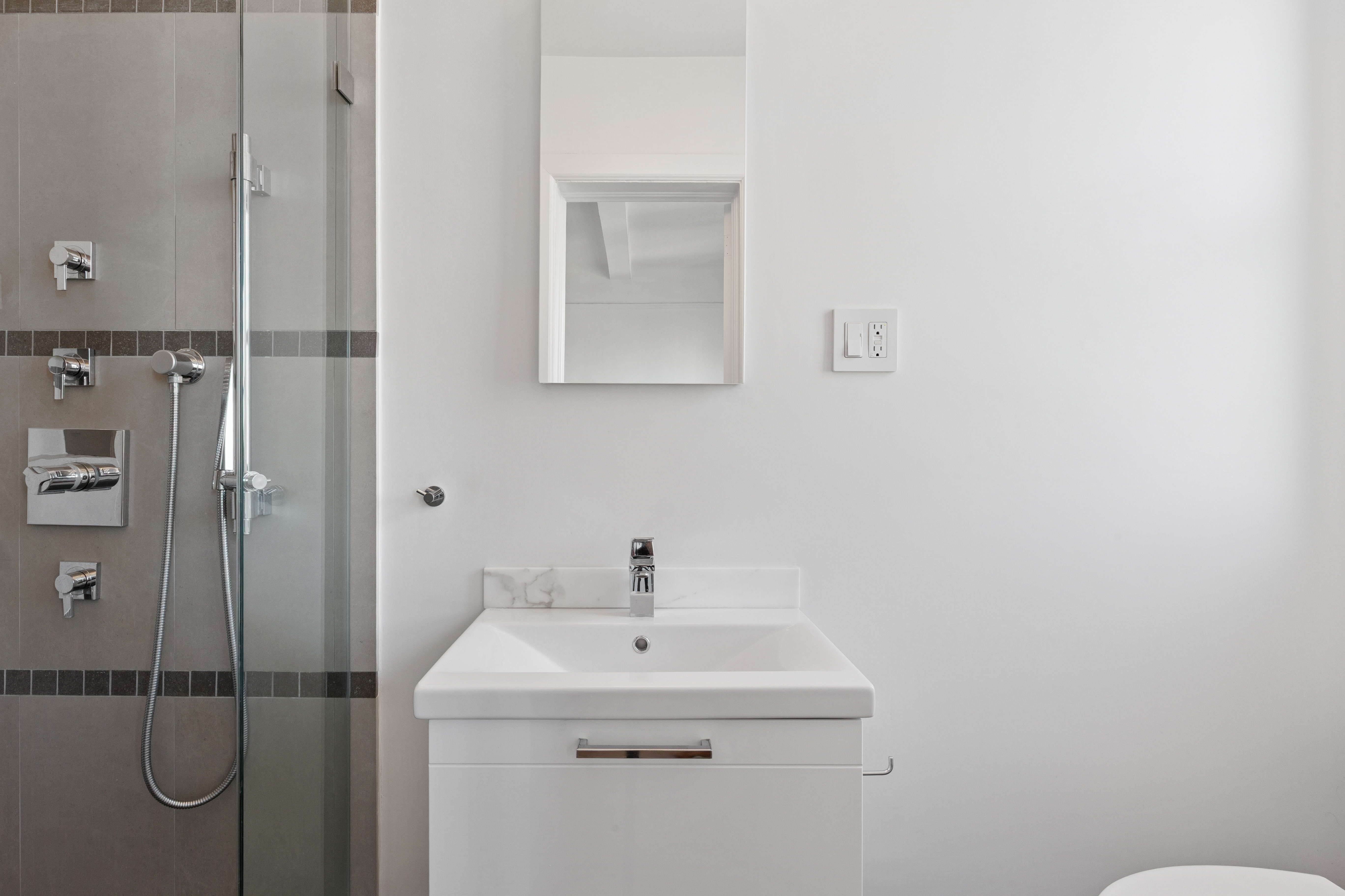 710 West End Avenue, Unit 14B Manhattan, NY 10025 - Photo 15 of 19 a bathroom with a sink and mirror