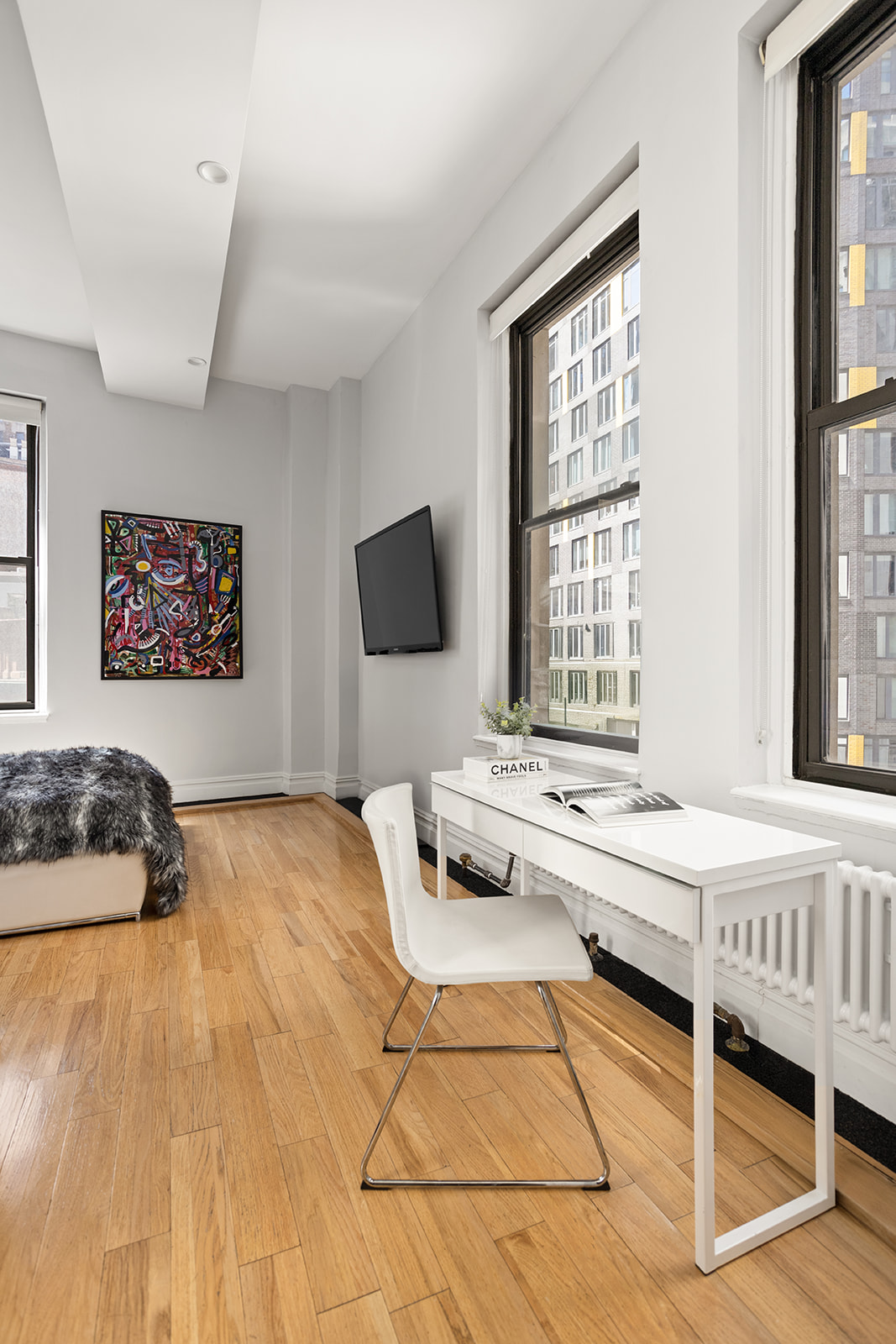 3 Hanover Square, Unit 7D Manhattan, NY 10004 - Photo 5 of 8 a bedroom with a bed and wooden floor